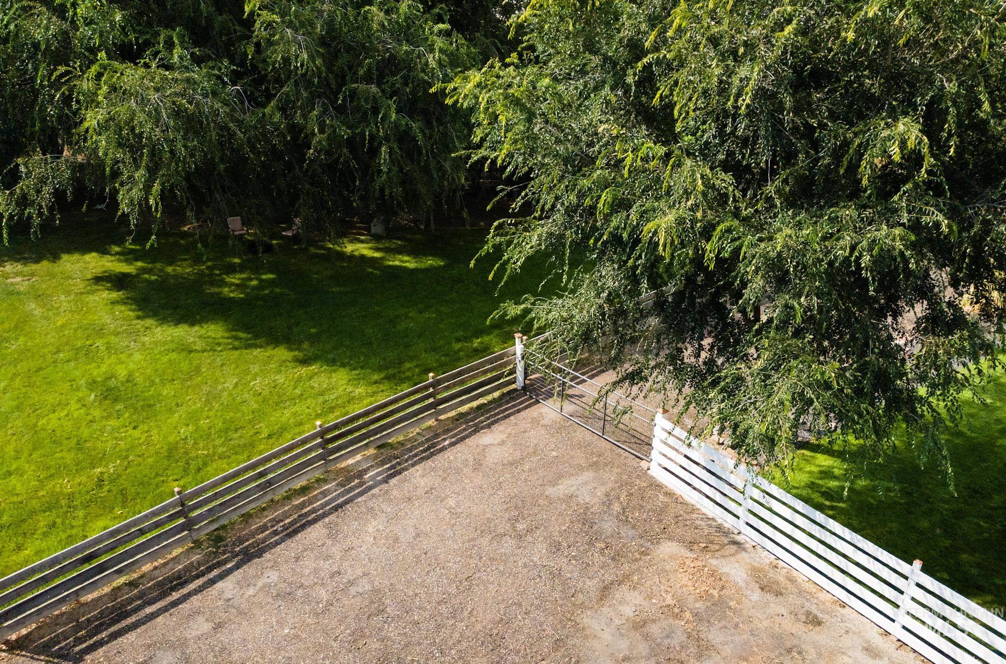 View of grassy yard with a baseboard heating unit