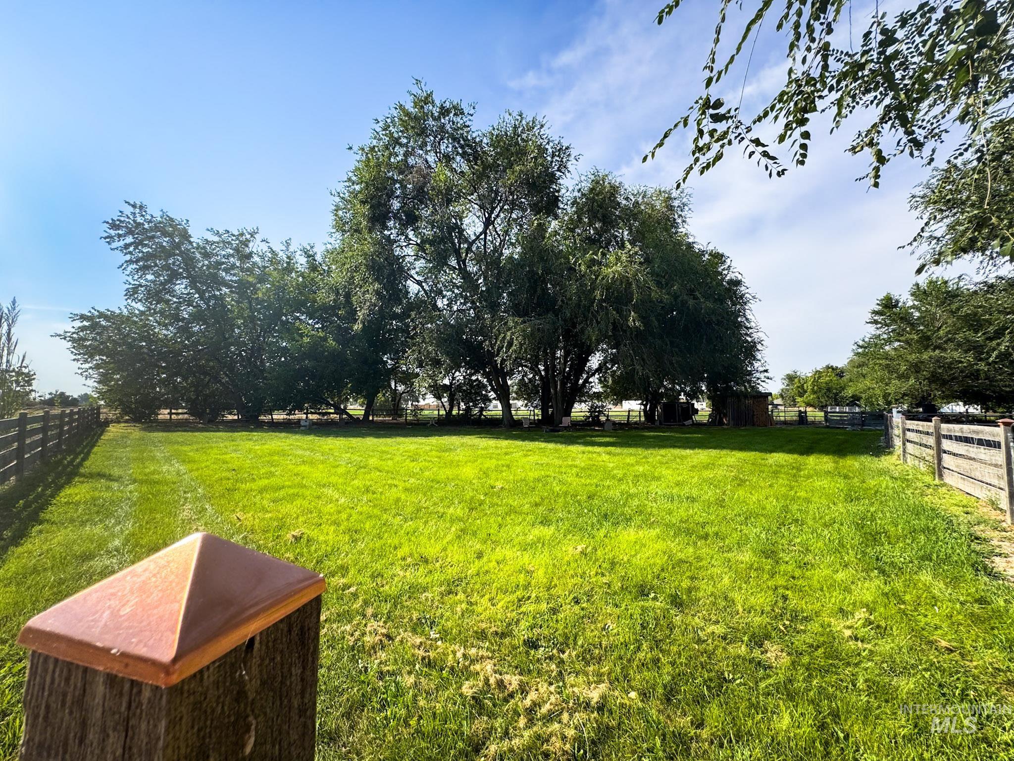 View of yard with a rural view
