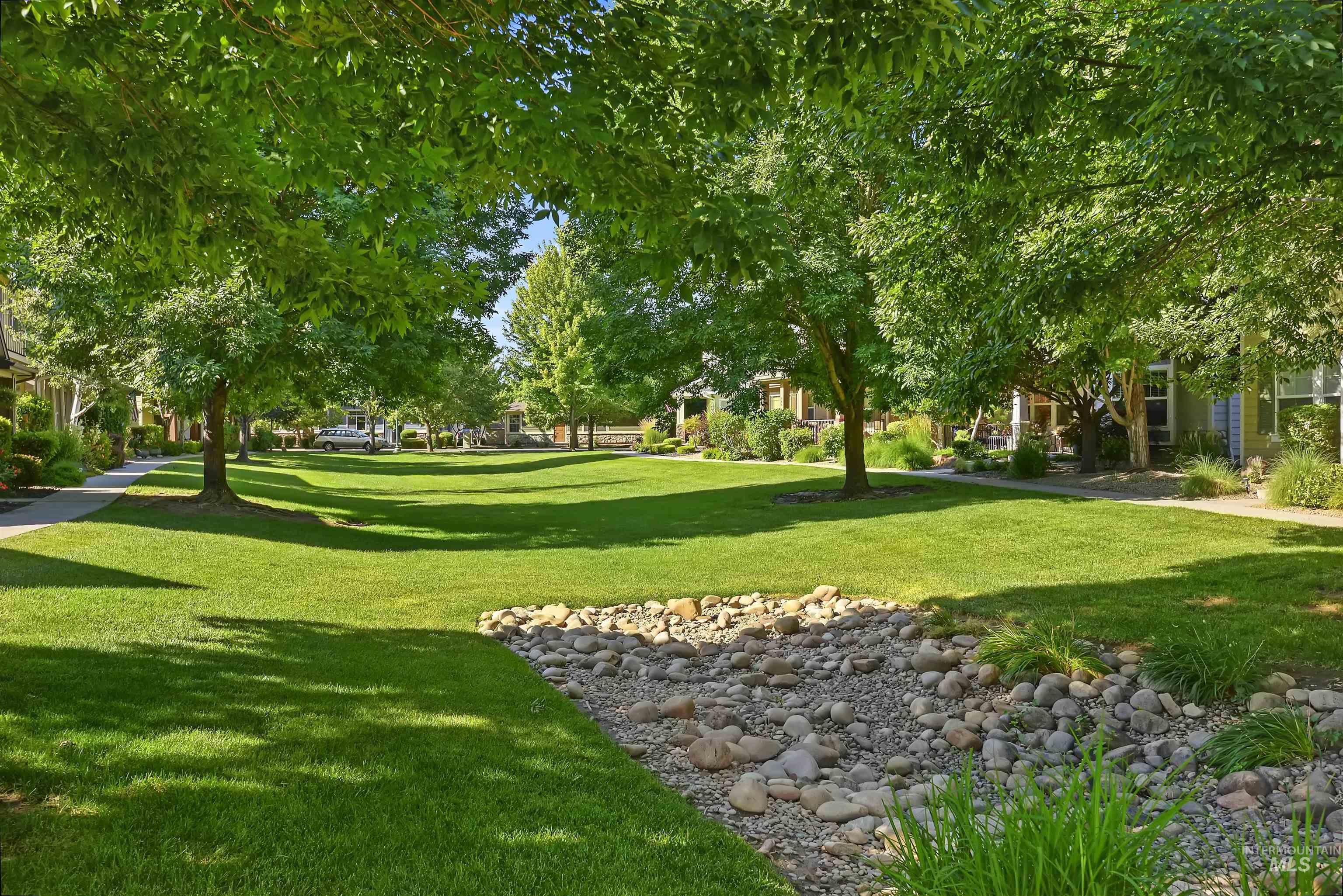 View of property's community featuring a yard