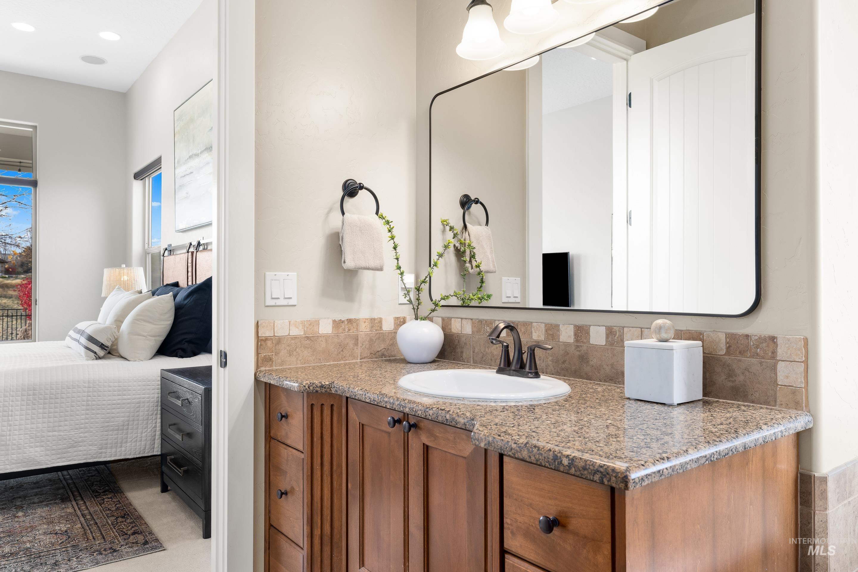 Ensuite bathroom featuring vanity