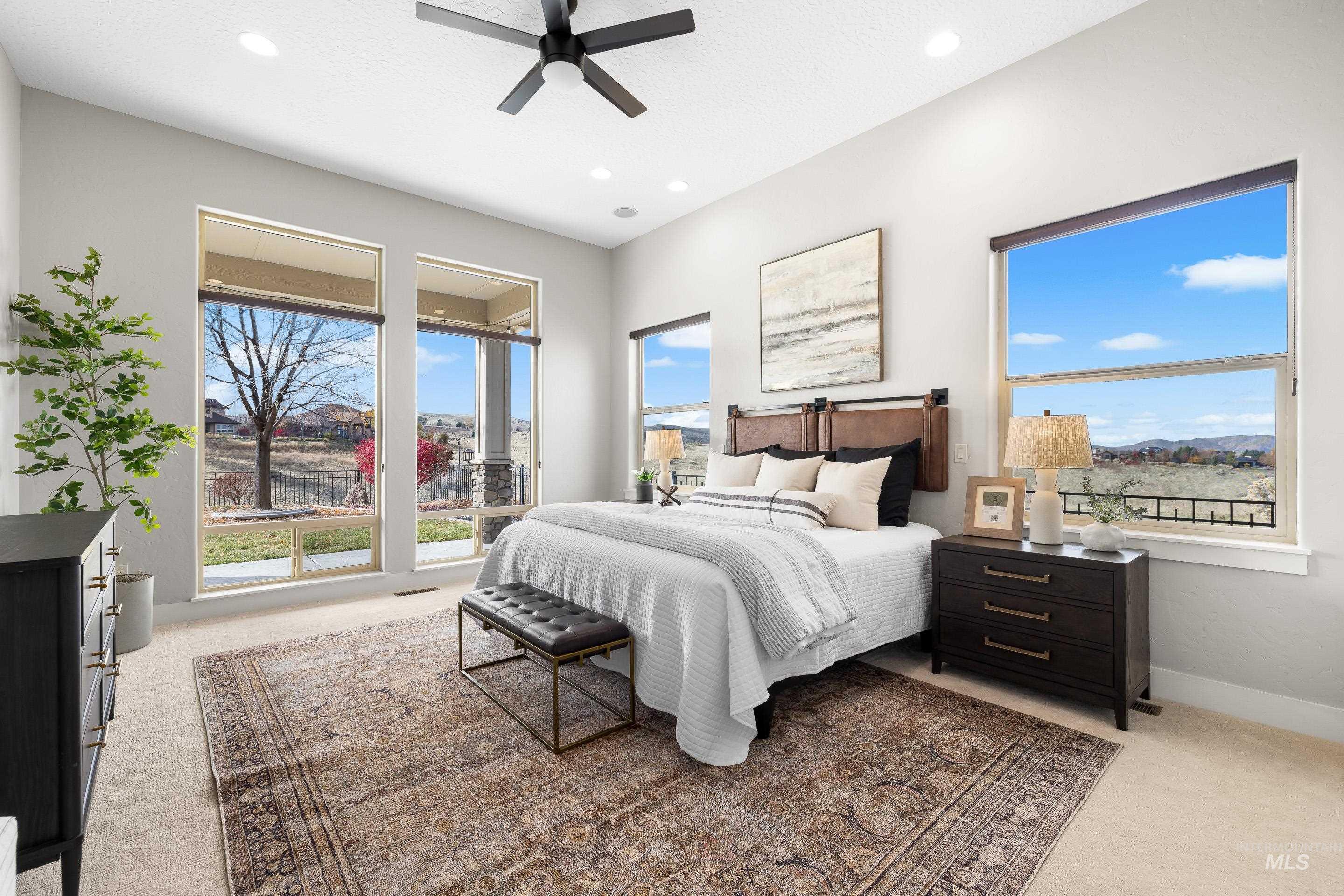 Bedroom featuring light carpet, a ceiling fan, and recessed lighting
