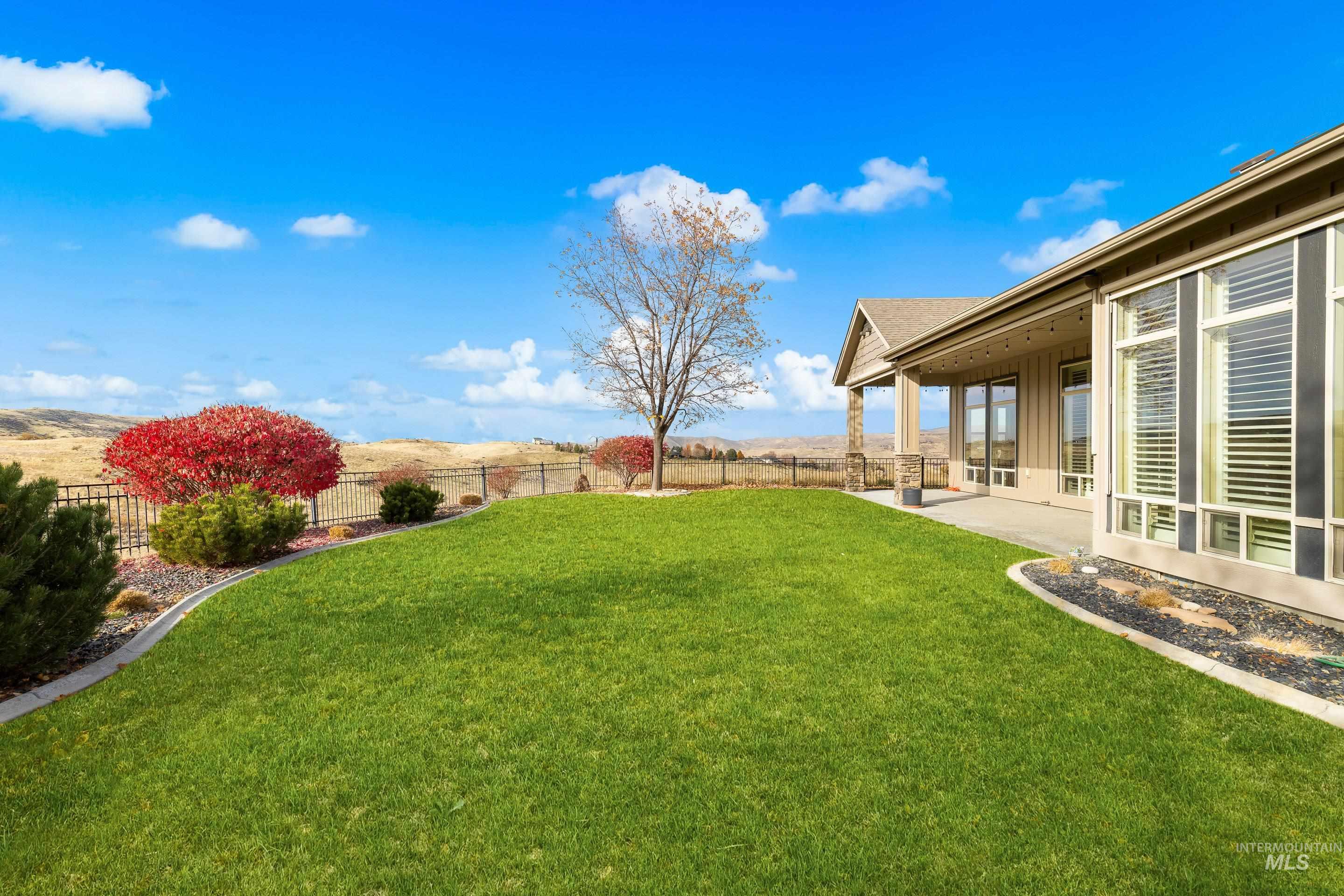 Fenced backyard with a patio