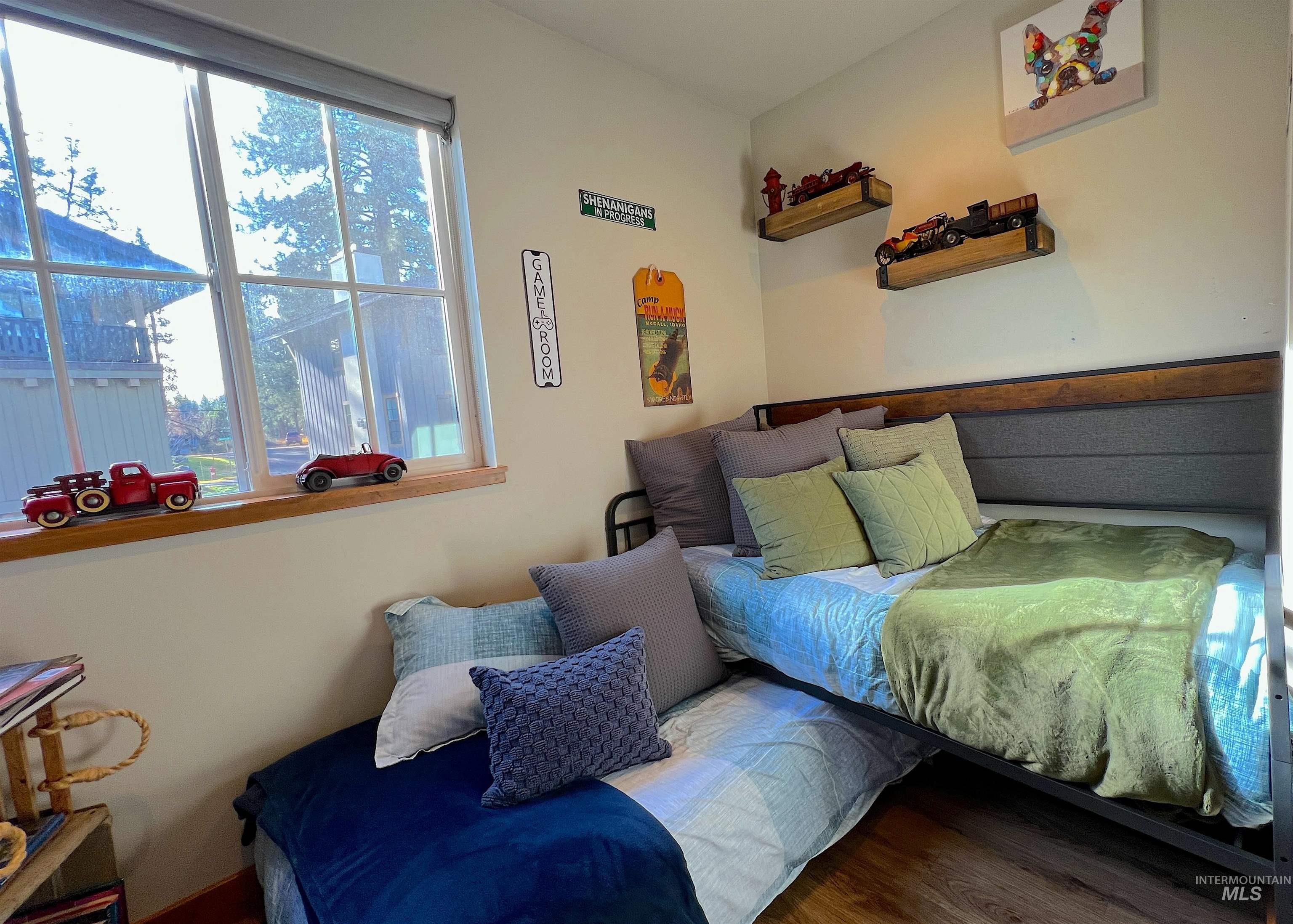 Bedroom with wood finished floors