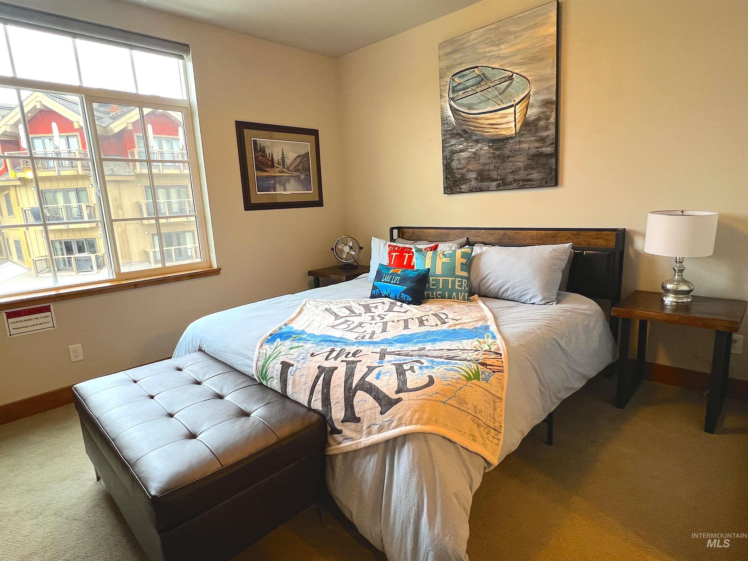 Carpeted bedroom featuring baseboards
