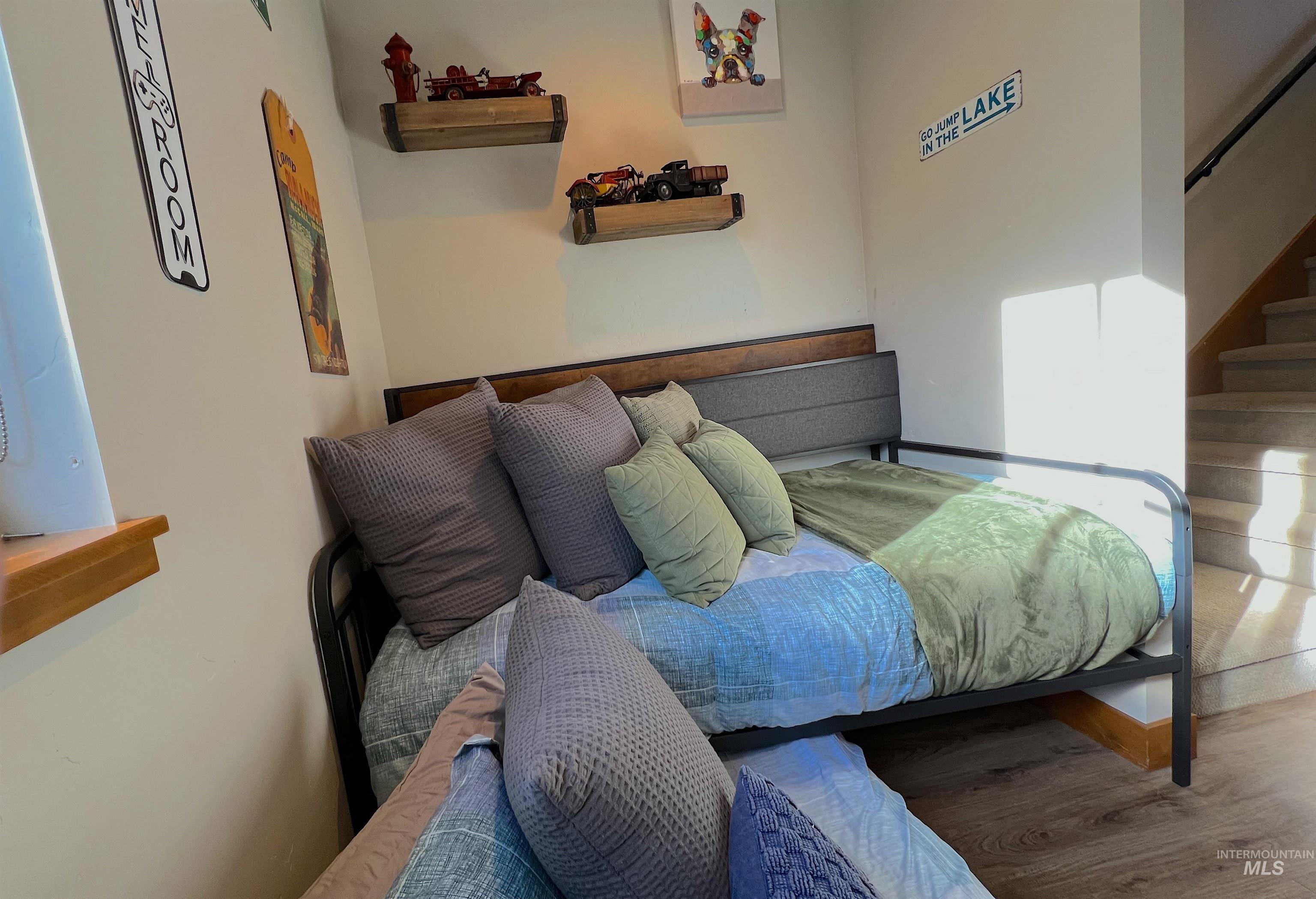 Bedroom with wood finished floors