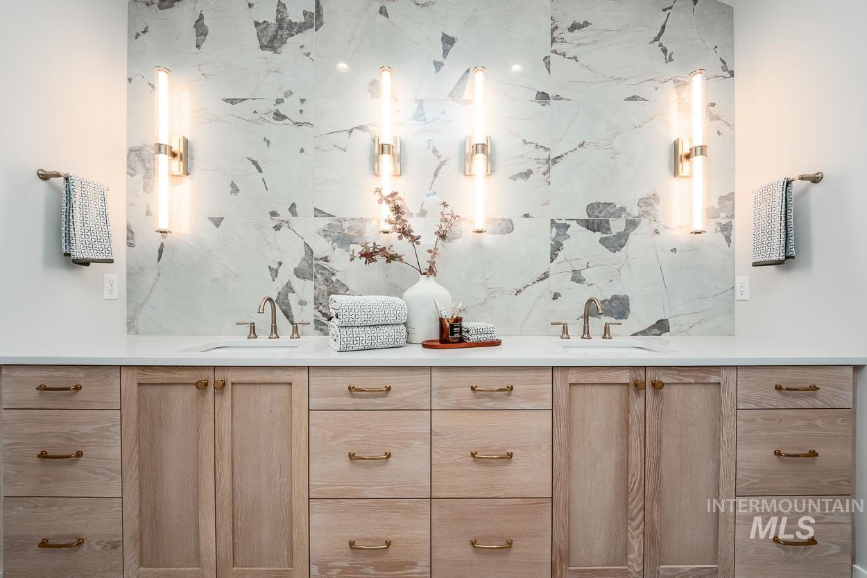 Full bath featuring double vanity