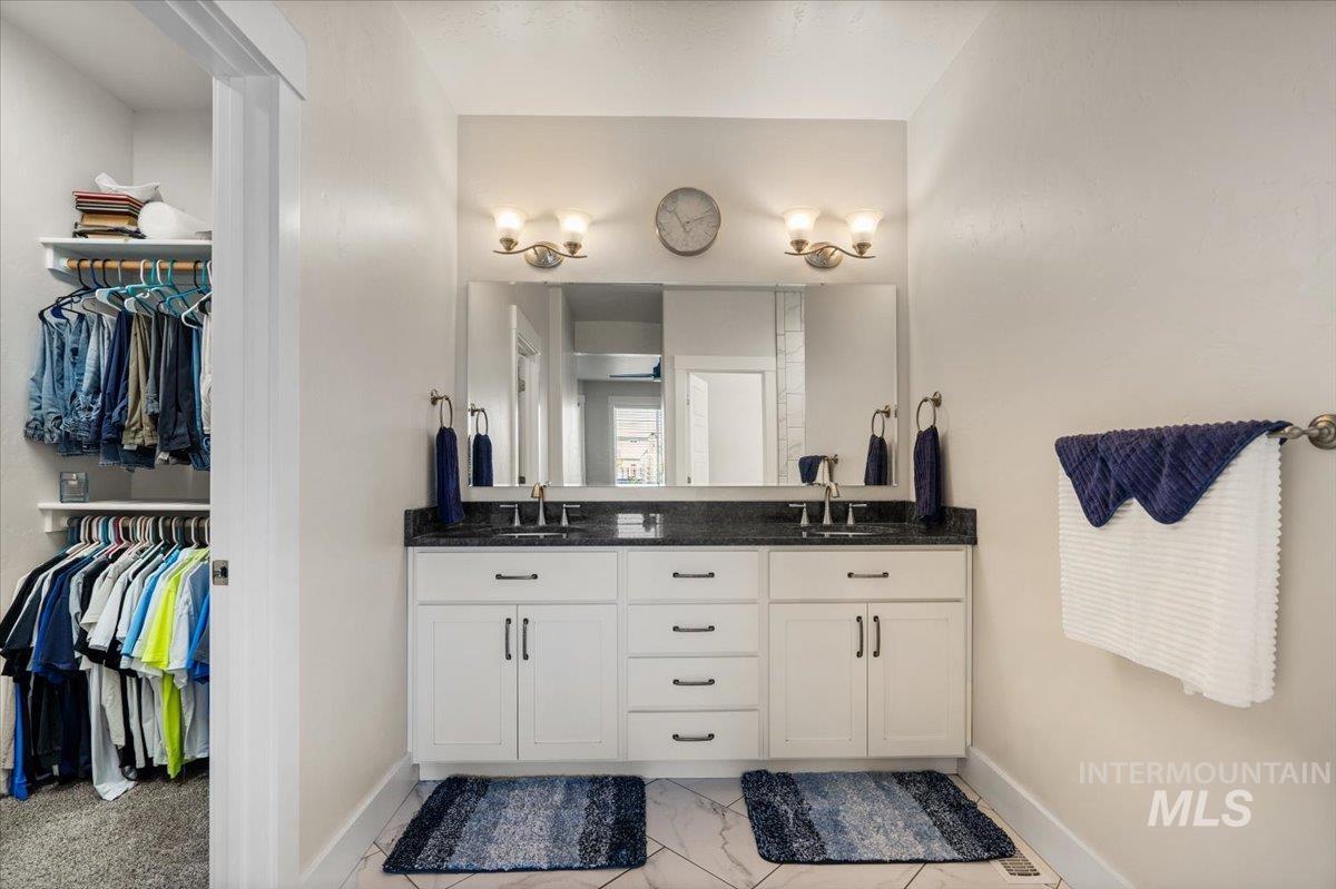 Primary bathroom with a walk-in shower.