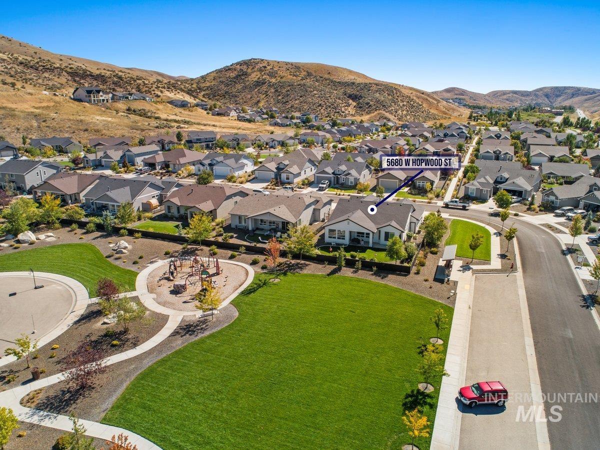 A large, grassy field as back neighbors.