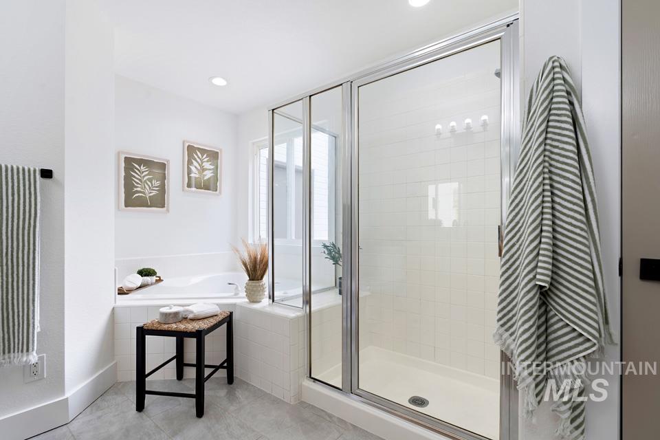 Full bath with a shower stall, a garden tub, tile patterned flooring, radiator heating unit, and recessed lighting