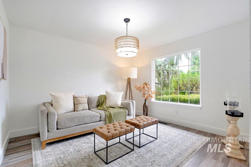 Living room with light wood finished floors and baseboards