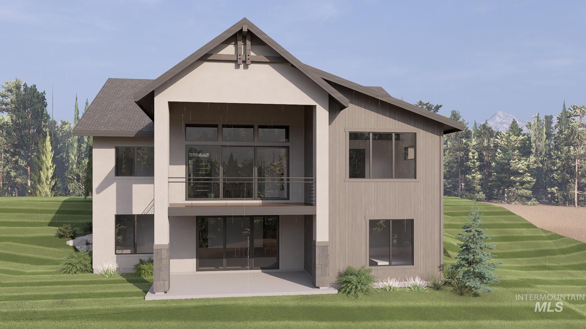 Back of house with a balcony and a lawn