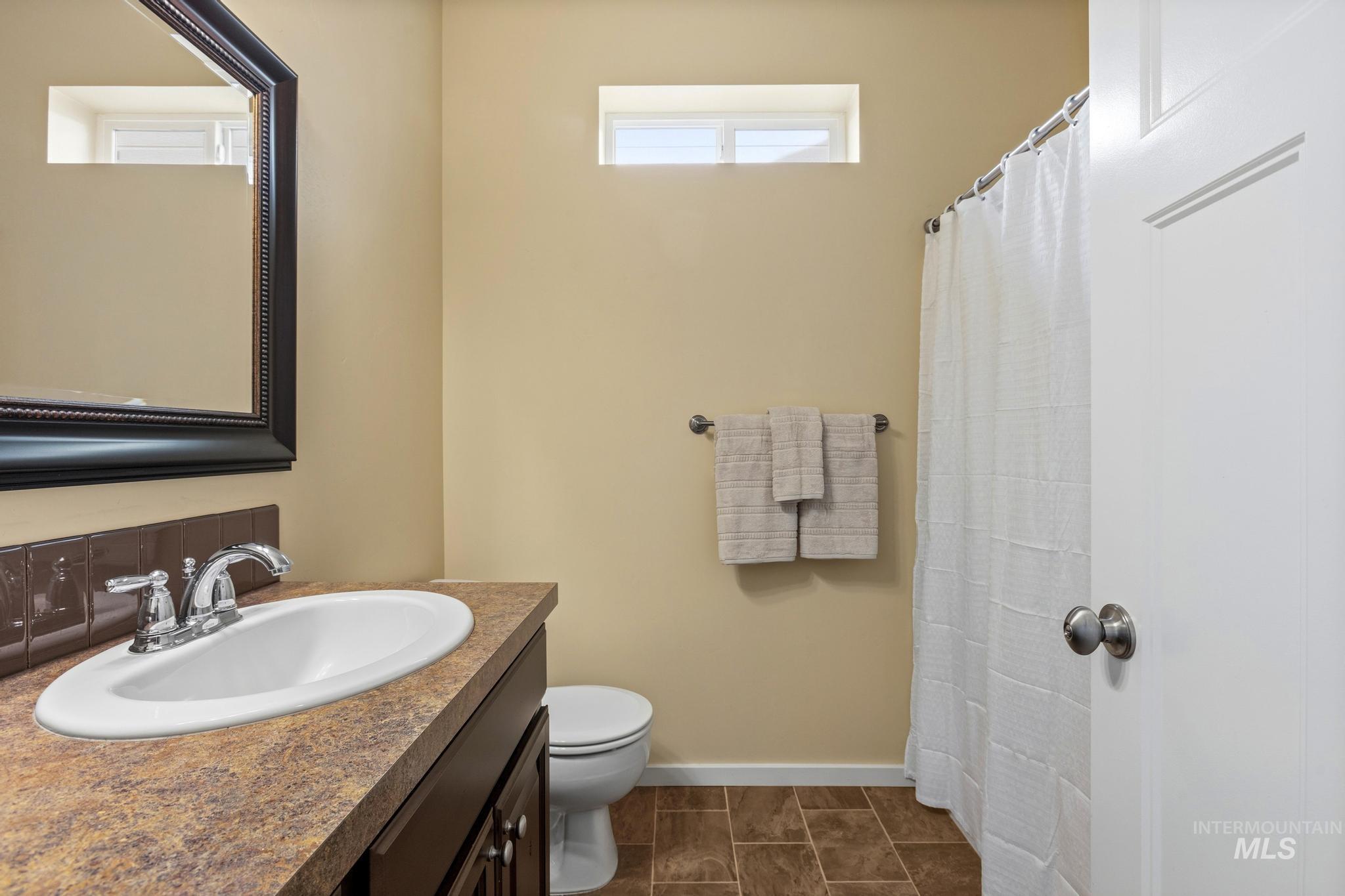 Bathroom with vanity and a shower with curtain