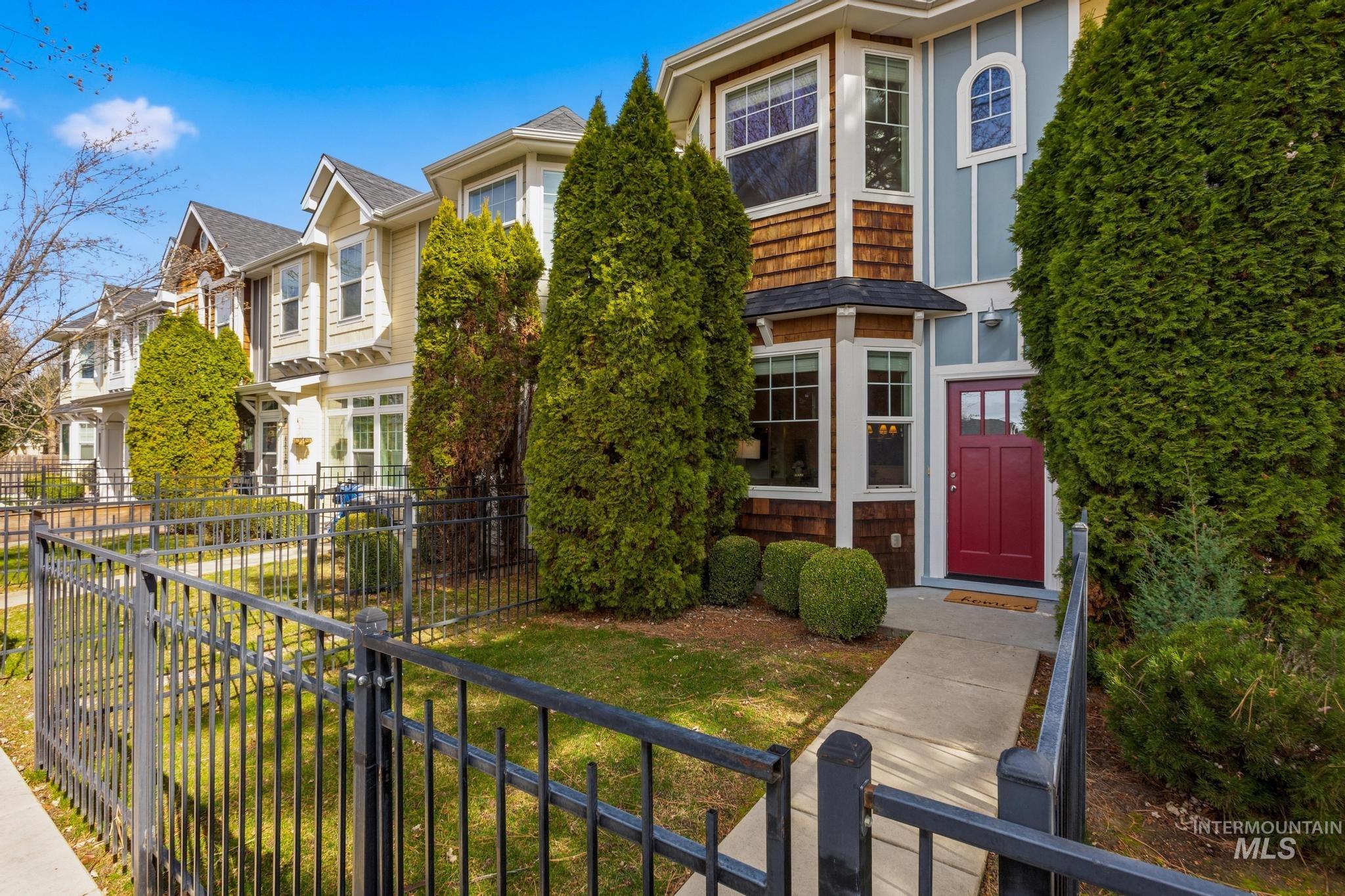 View of front facade featuring a fenced front yard and a residential view