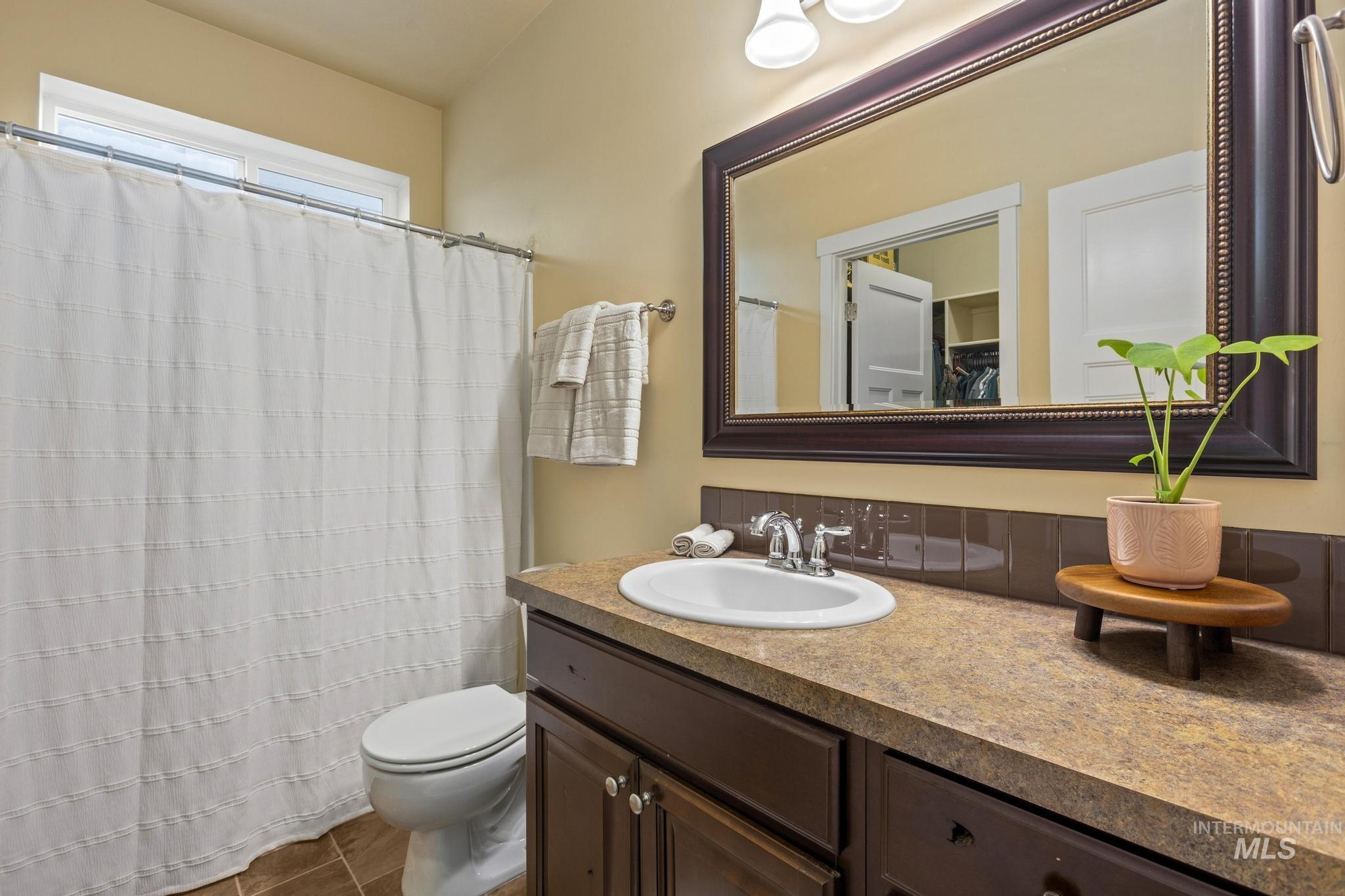 Bathroom with vanity and a shower with curtain