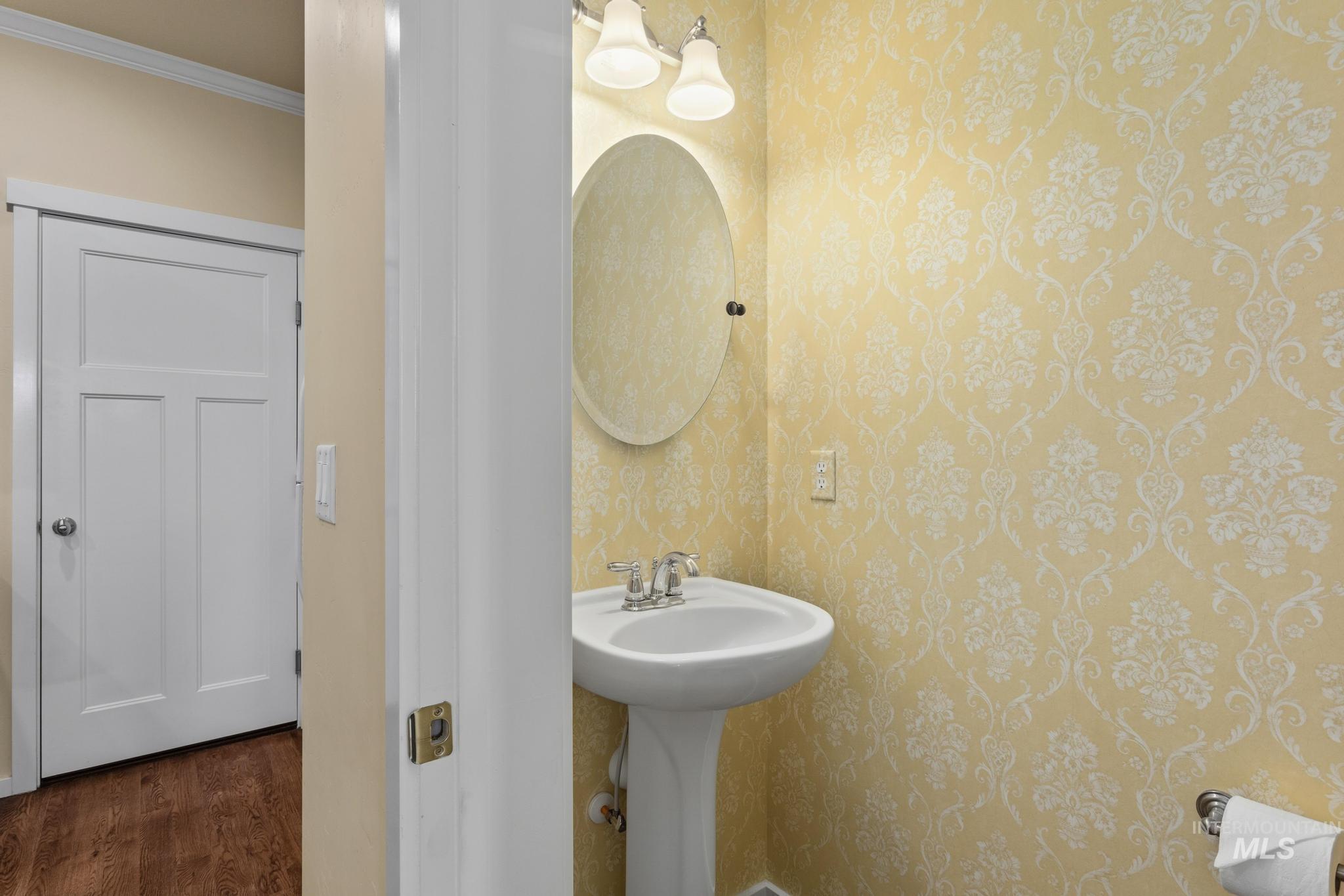 Half bath featuring crown molding