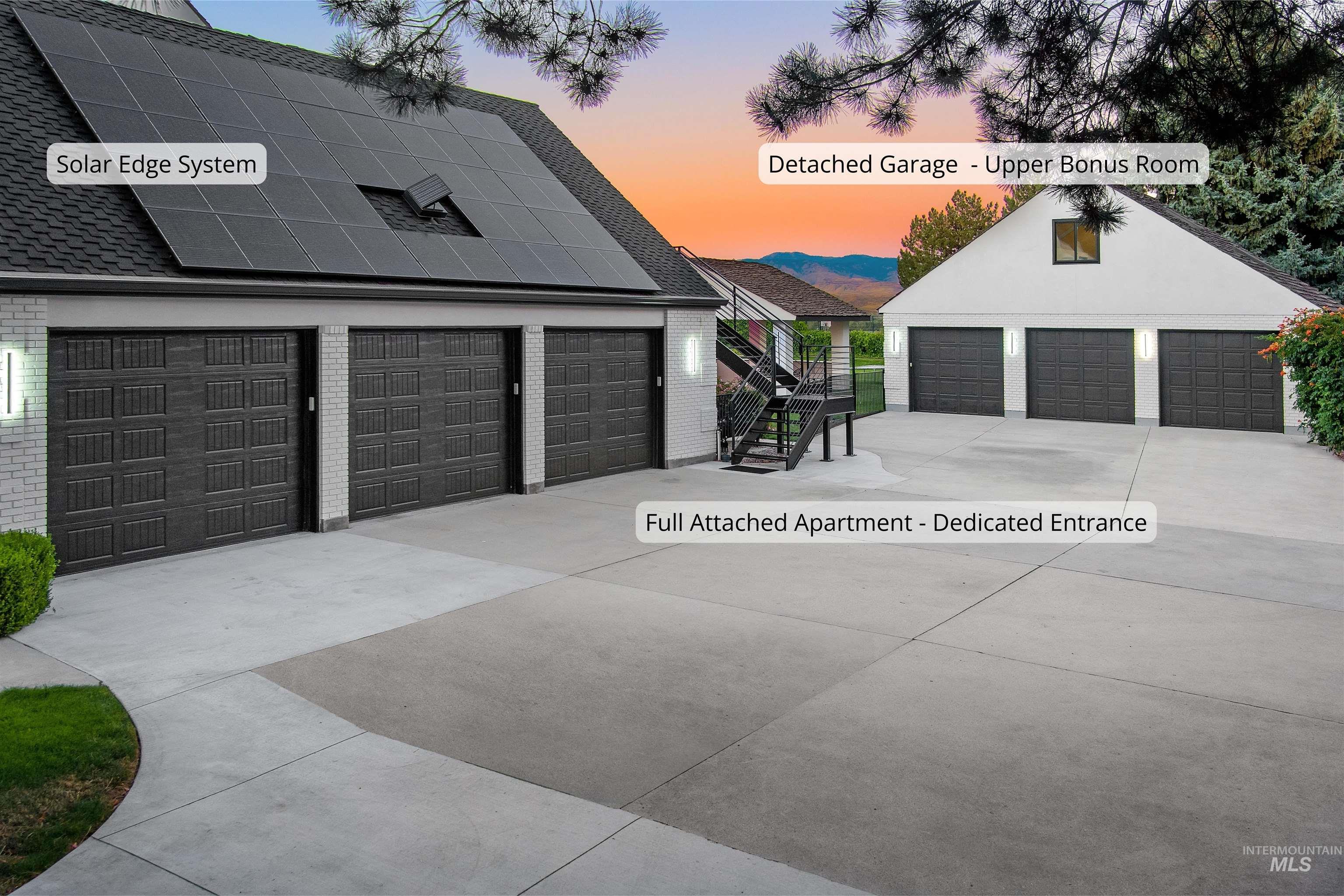 Garage at dusk featuring solar panels