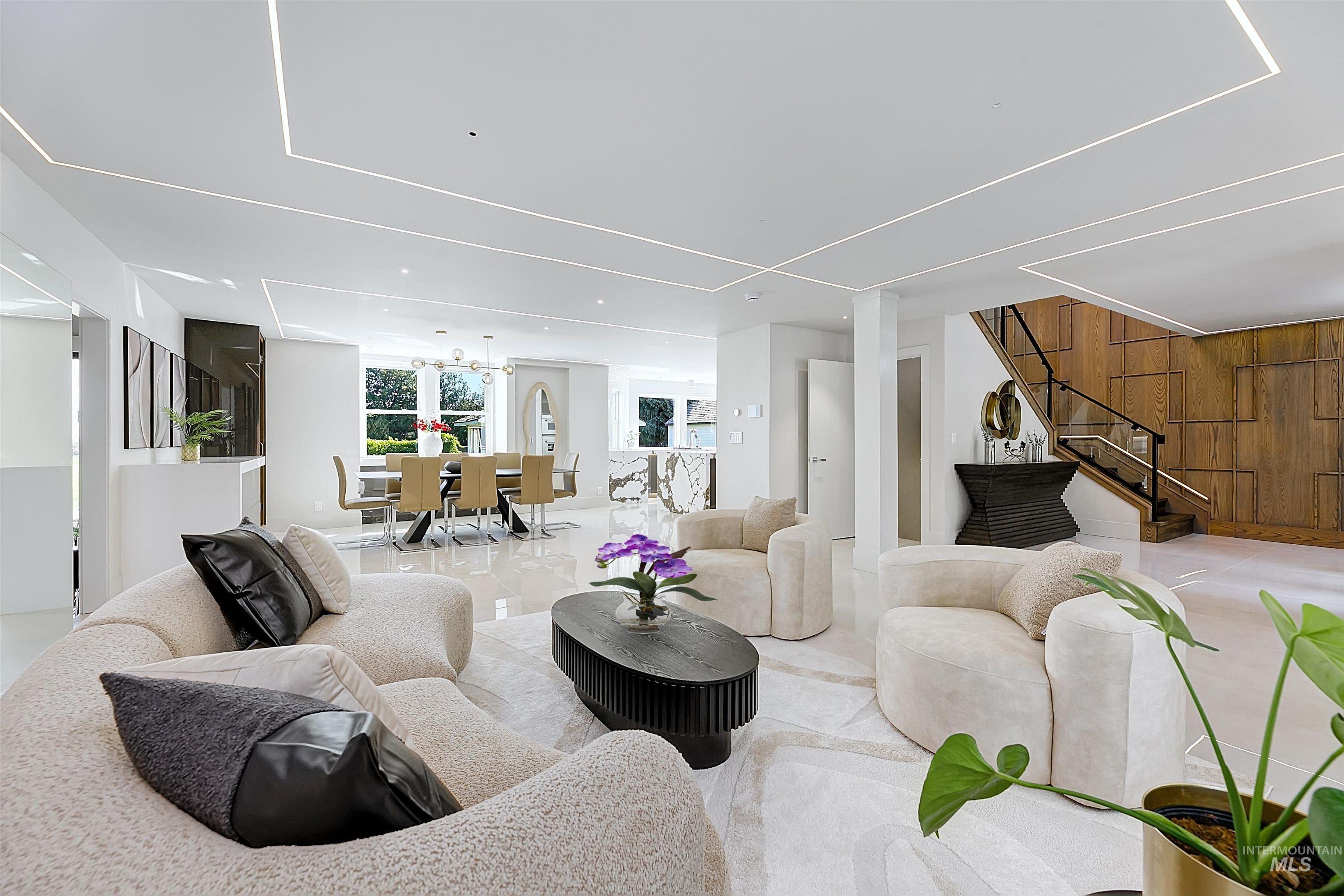 Living area with stairs and wooden wall accents.