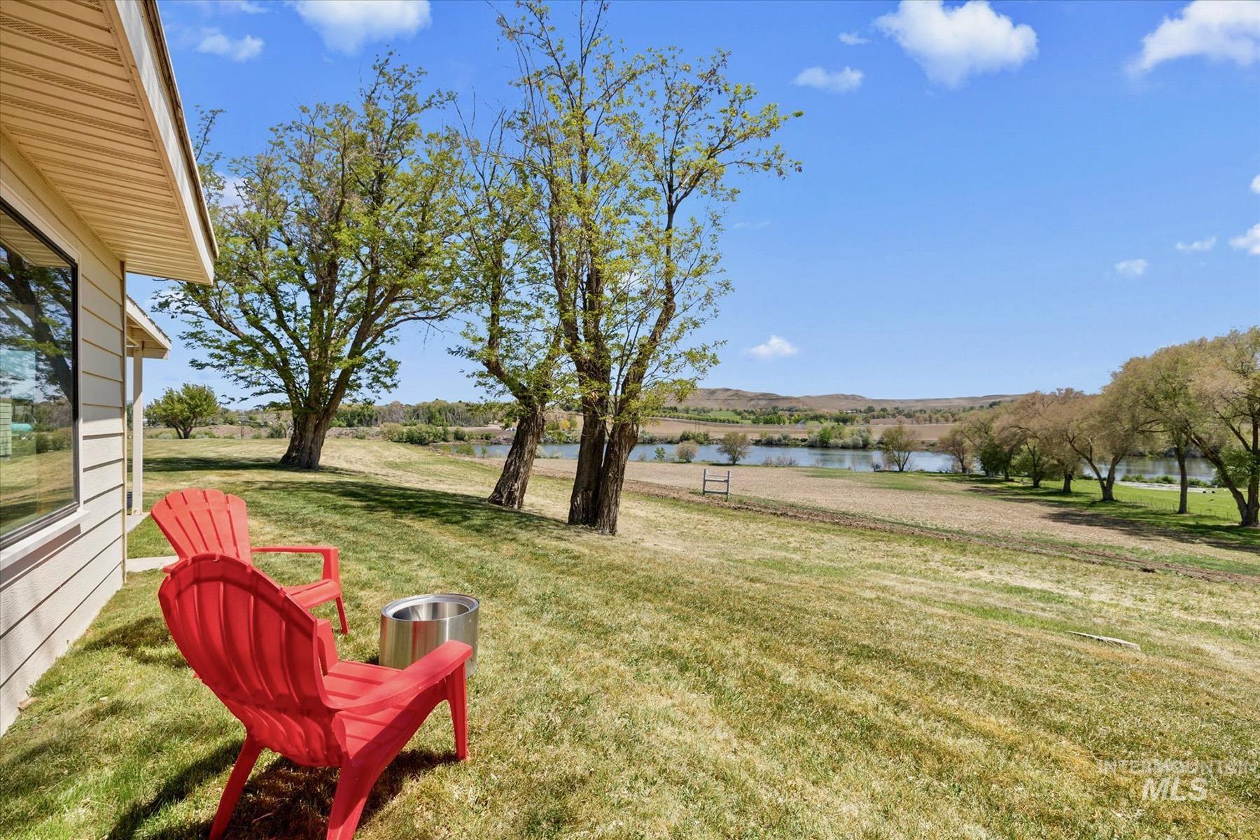 View of green lawn featuring a water view