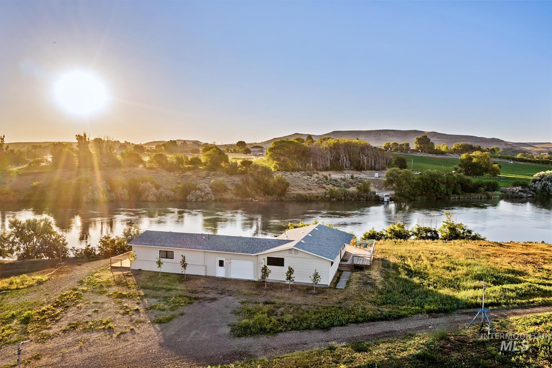 Aerial view at dusk of a water and mountain view
