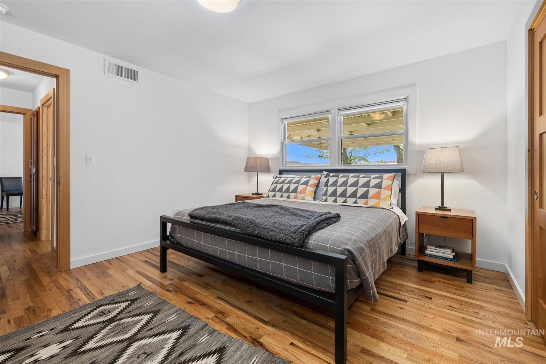 Bedroom featuring baseboards and light wood-style floors