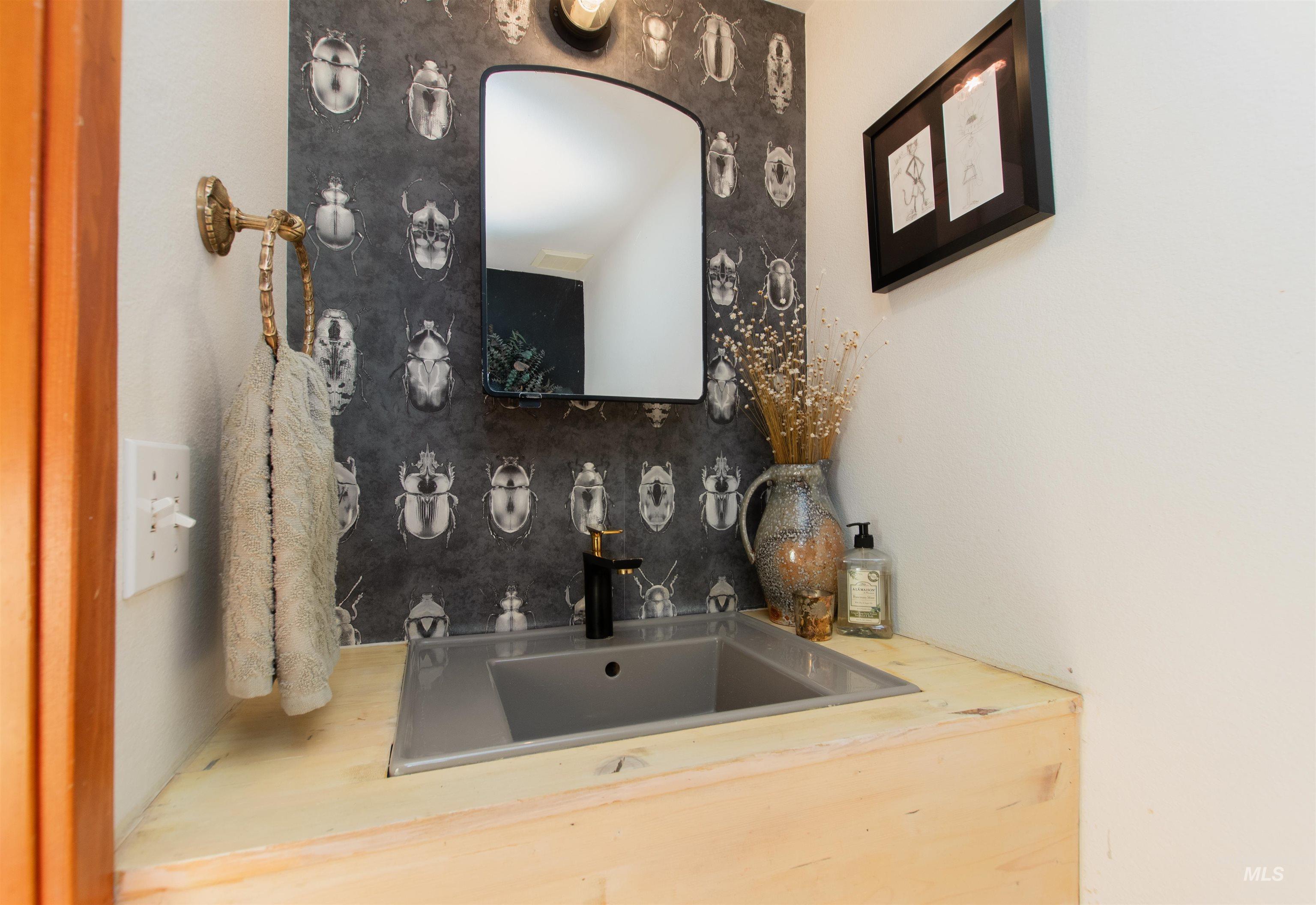 Bathroom with backsplash and vanity