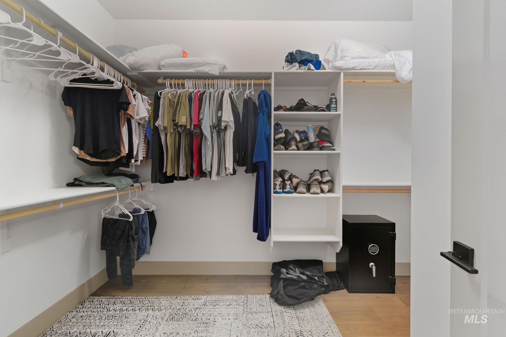 Spacious closet featuring light wood-style floors