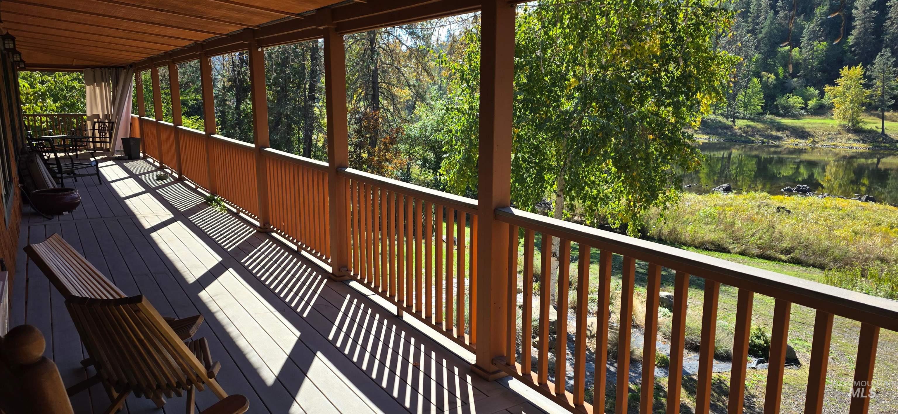 Wooden deck featuring a water view