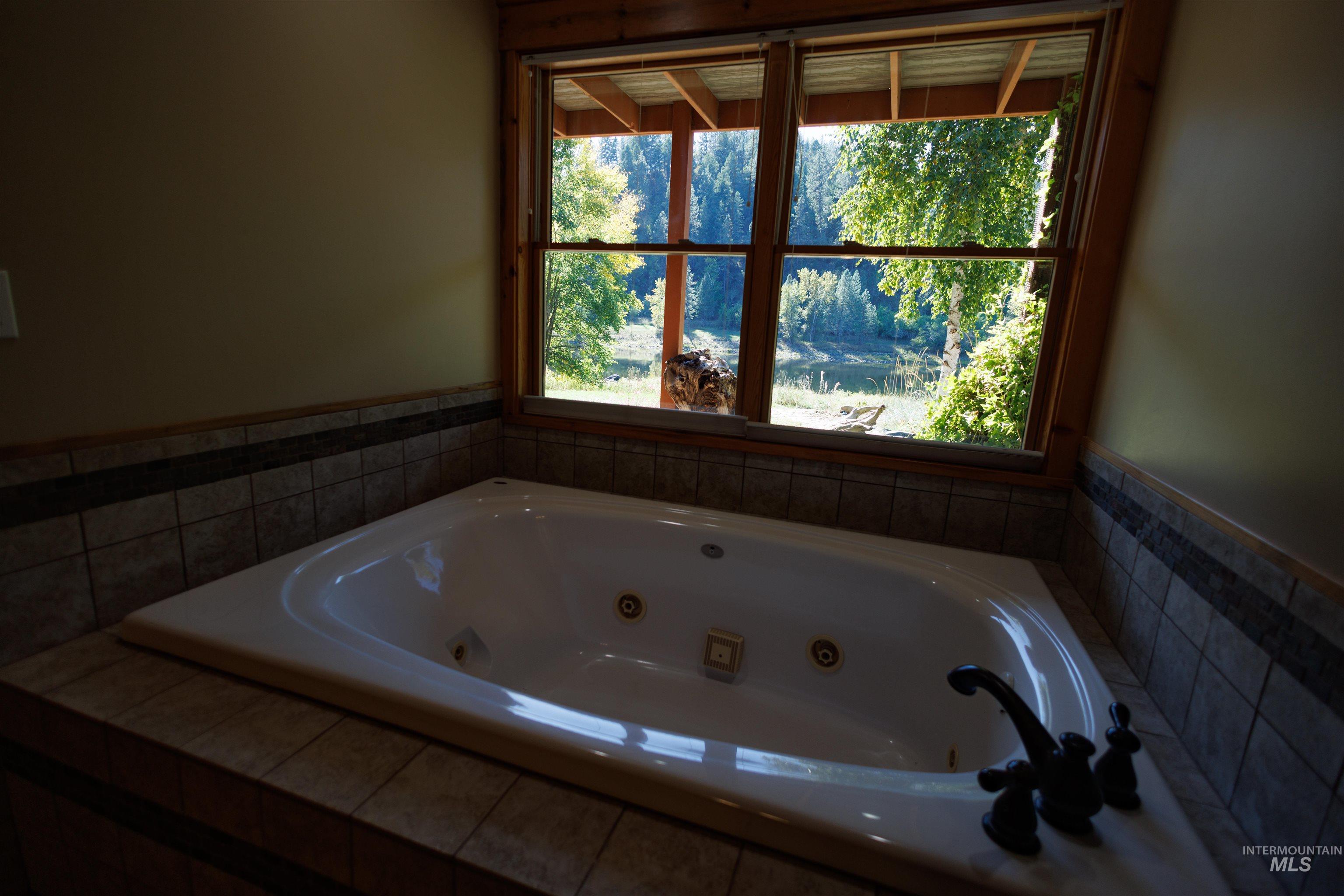 Bathroom with a jetted tub