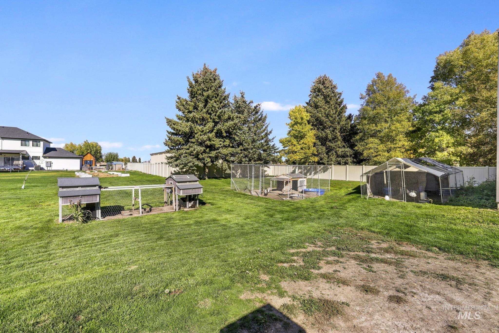View of yard featuring exterior structure, an outbuilding, and a patio area