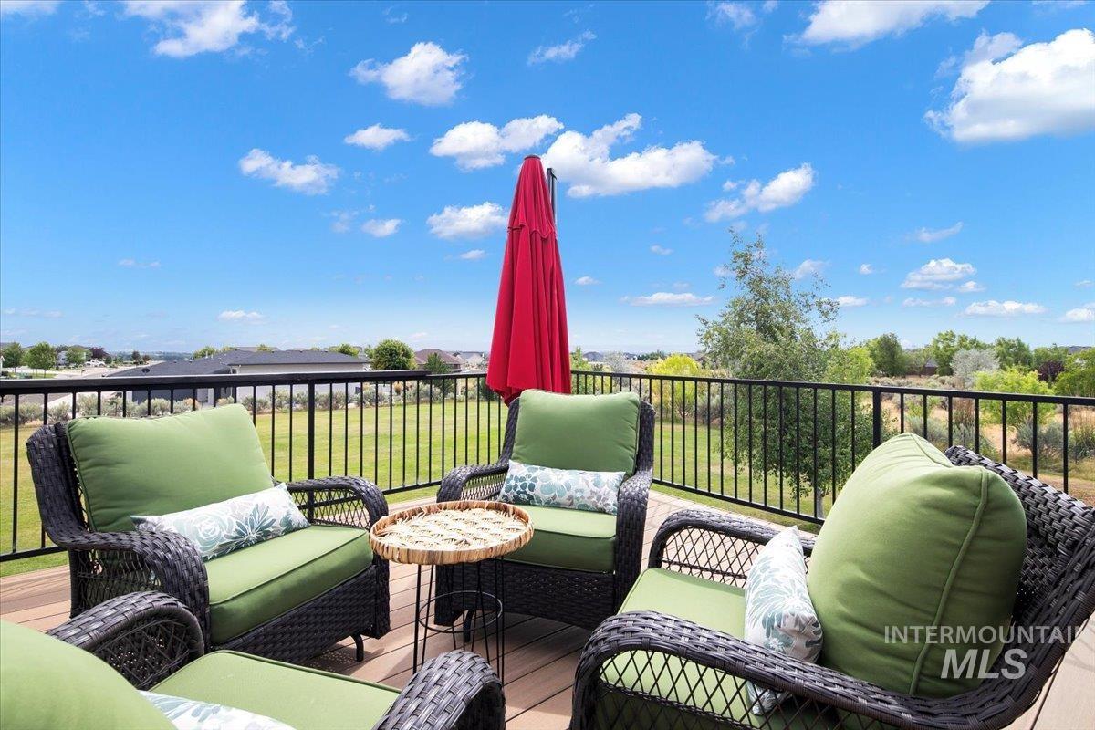 Wooden terrace featuring an outdoor hangout area off of the great room.