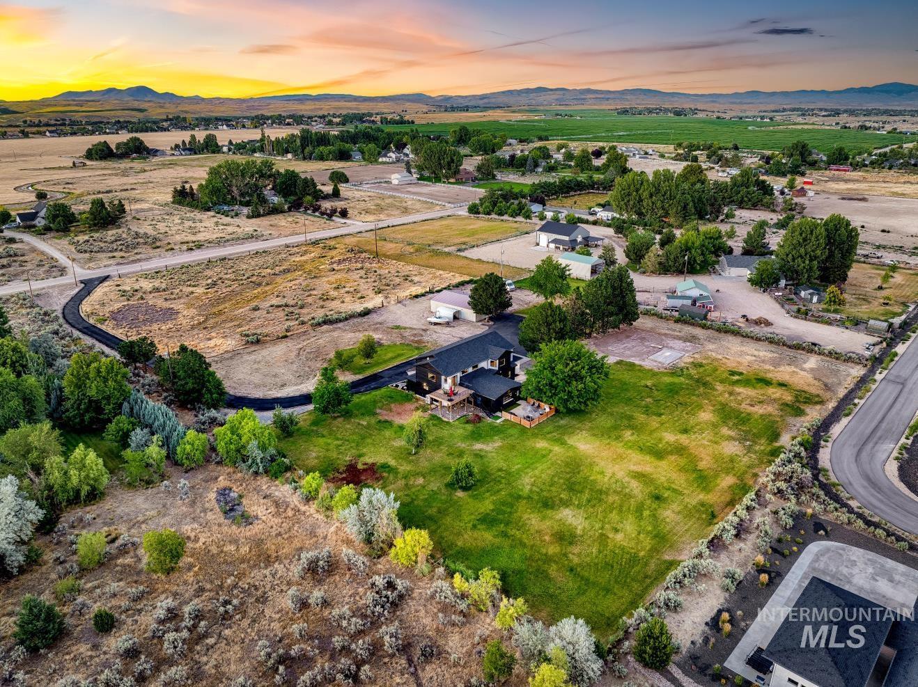 Drone / aerial view over property of a mountain backdrop