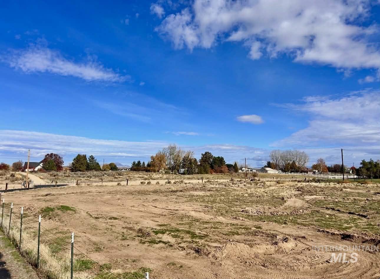 View of yard with a rural view