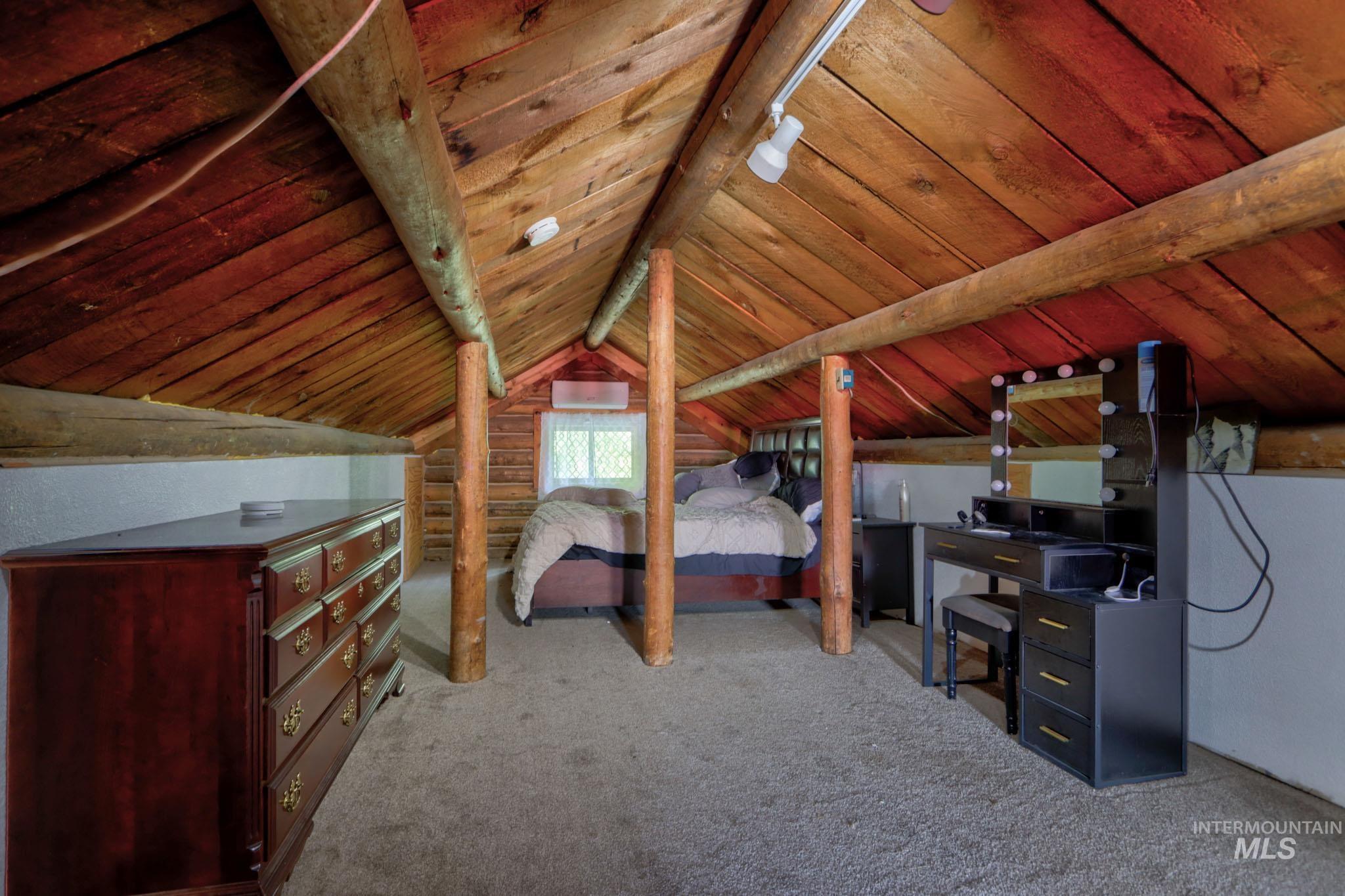 Bedroom with carpet flooring and wood ceiling