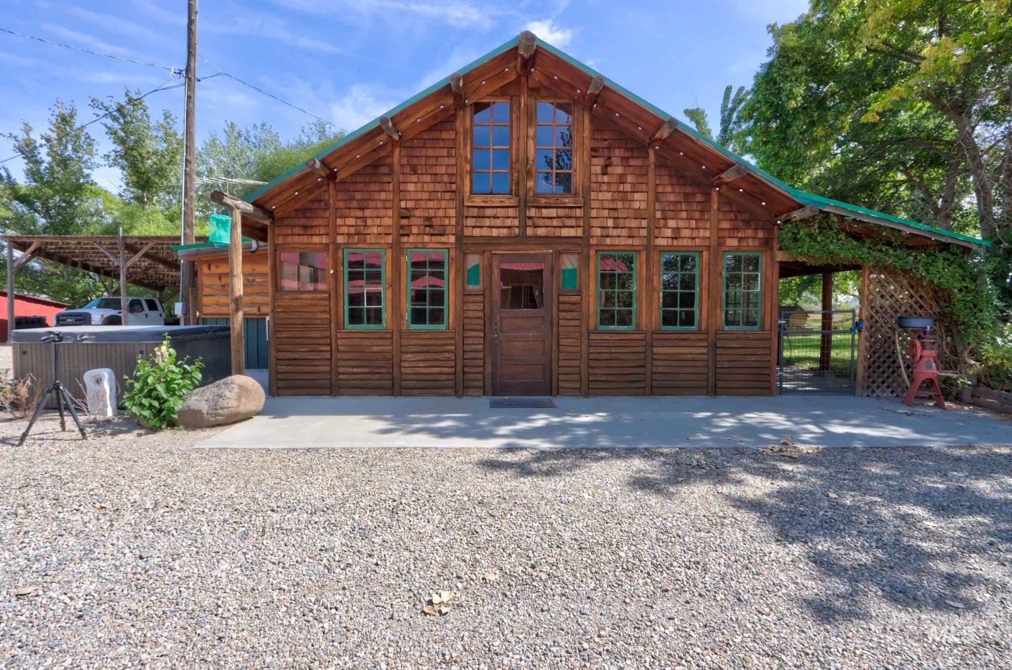 View of front of property with a hot tub