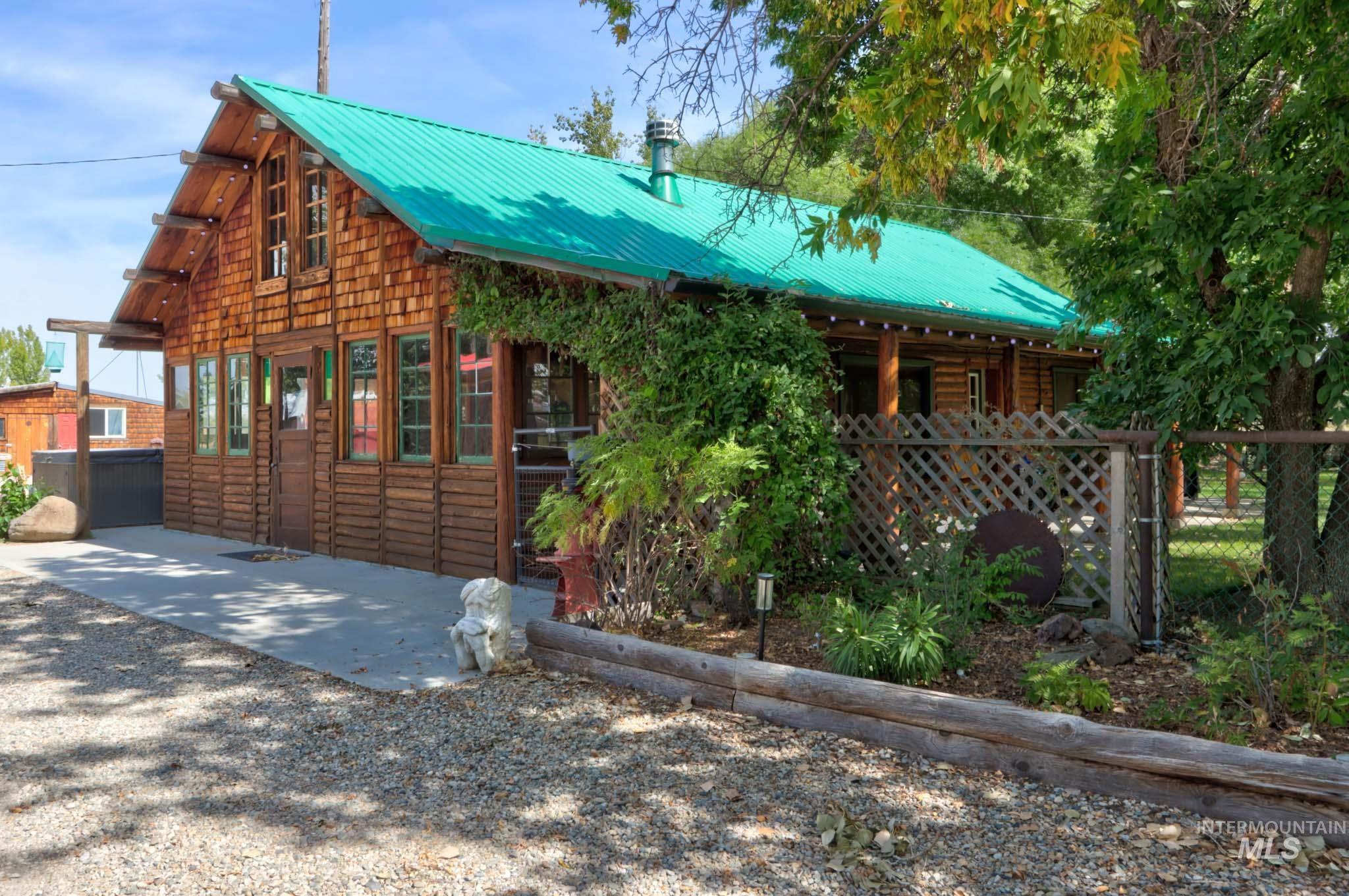View of front of house with a metal roof