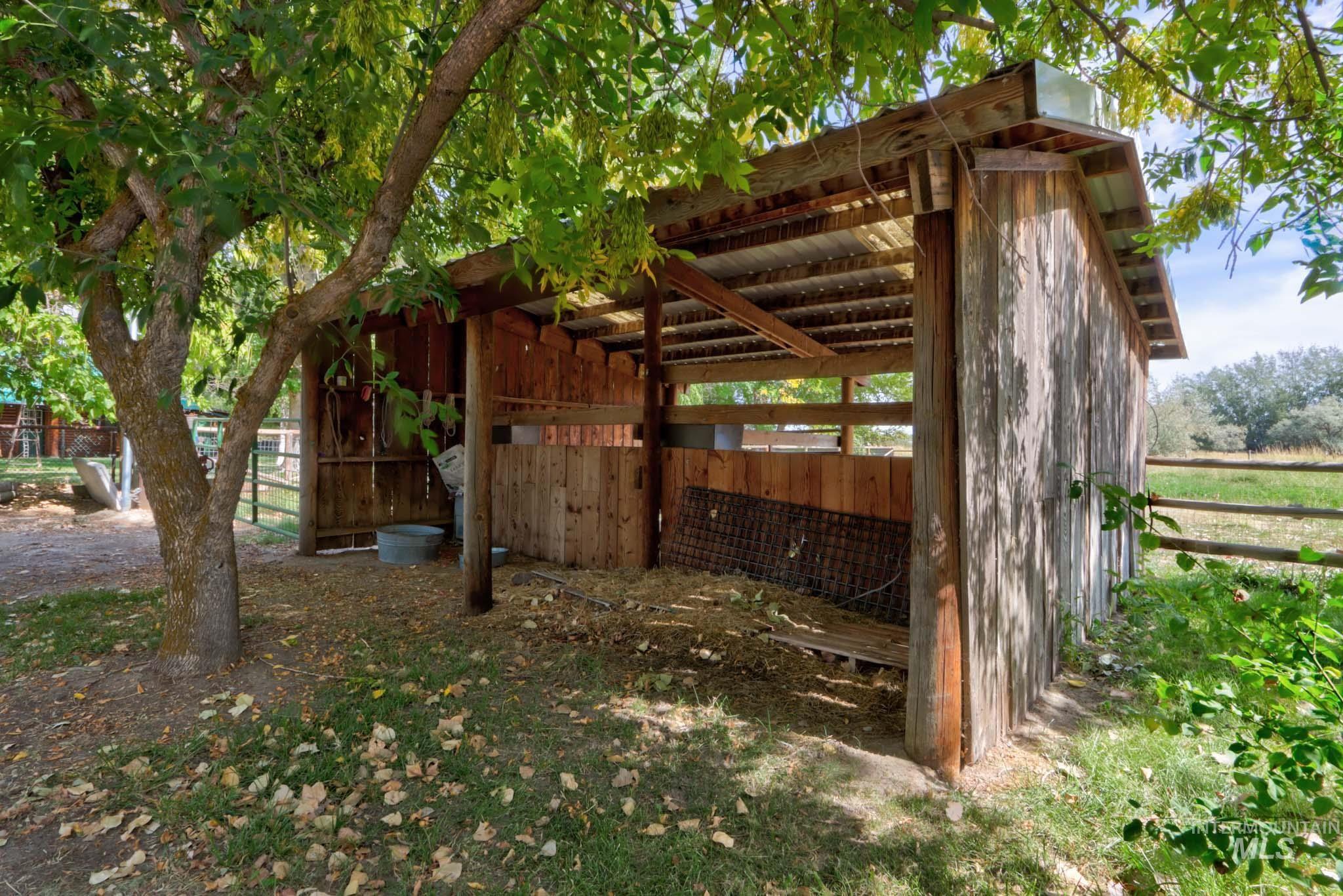View of side of home with an outdoor structure and an exterior structure