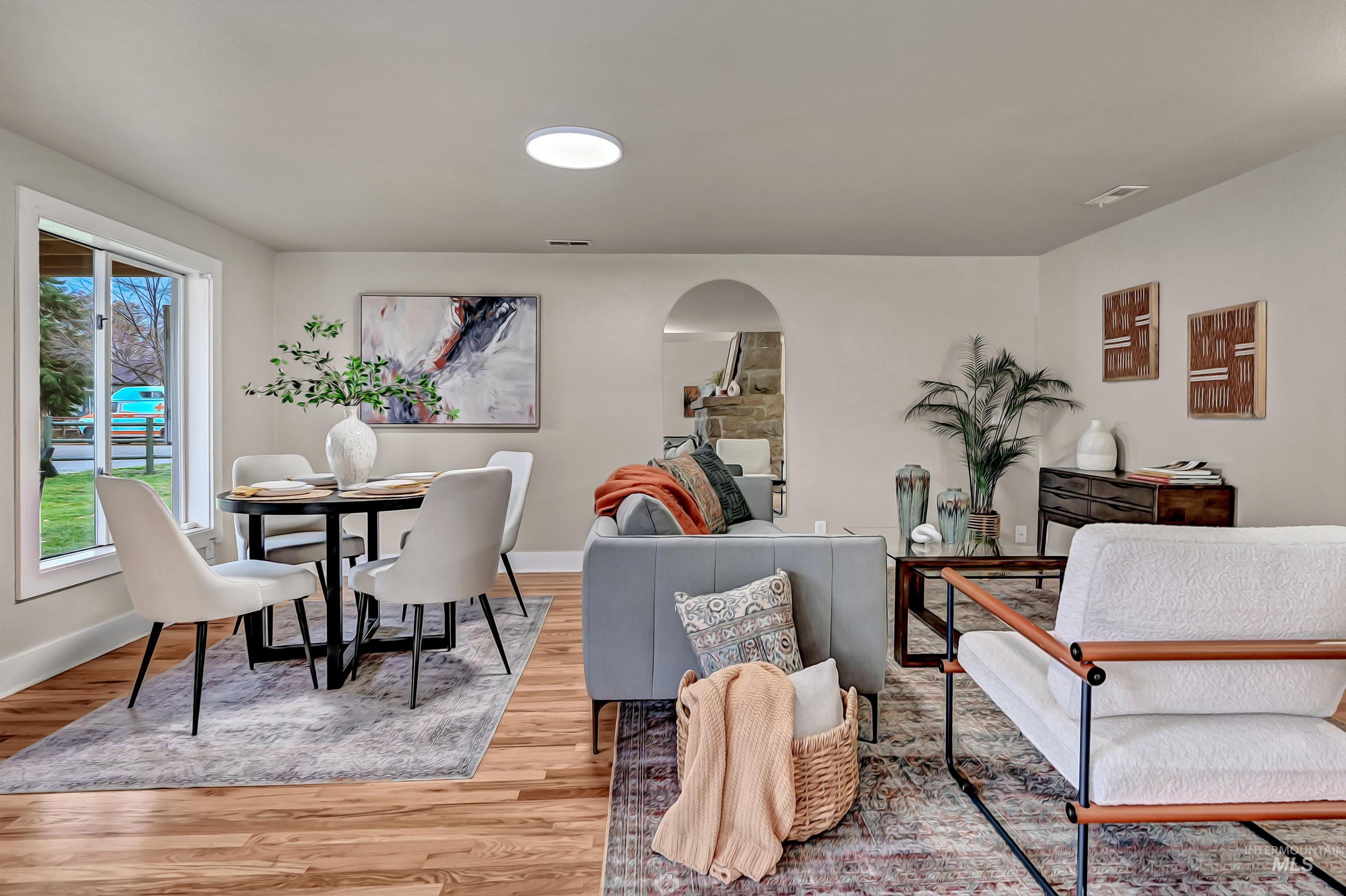 Cozy living and dining space highlighted by warm hardwood floors and a functional, inviting layout.