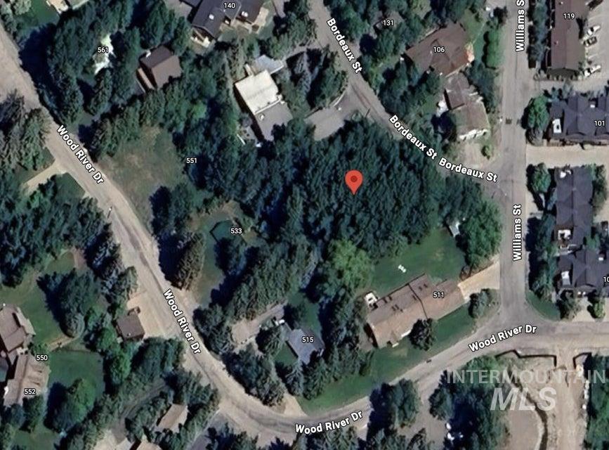 Aerial overview of property's location featuring nearby suburban area