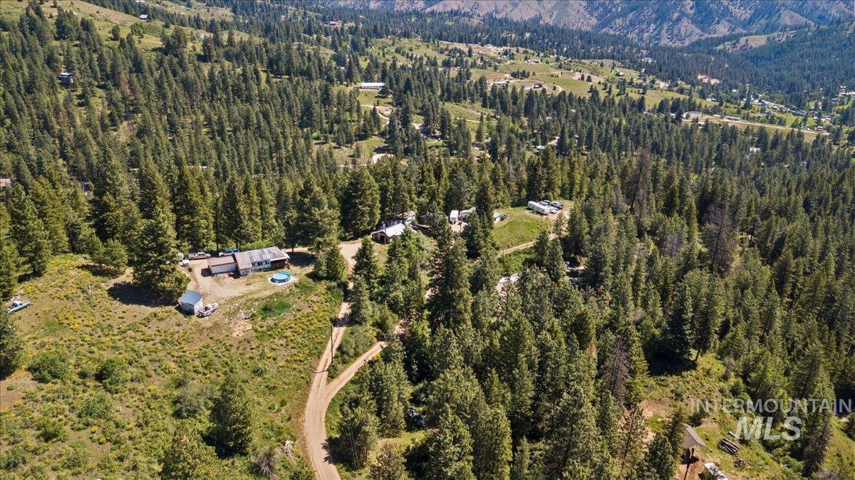 View of property location featuring a forest and a mountain backdrop