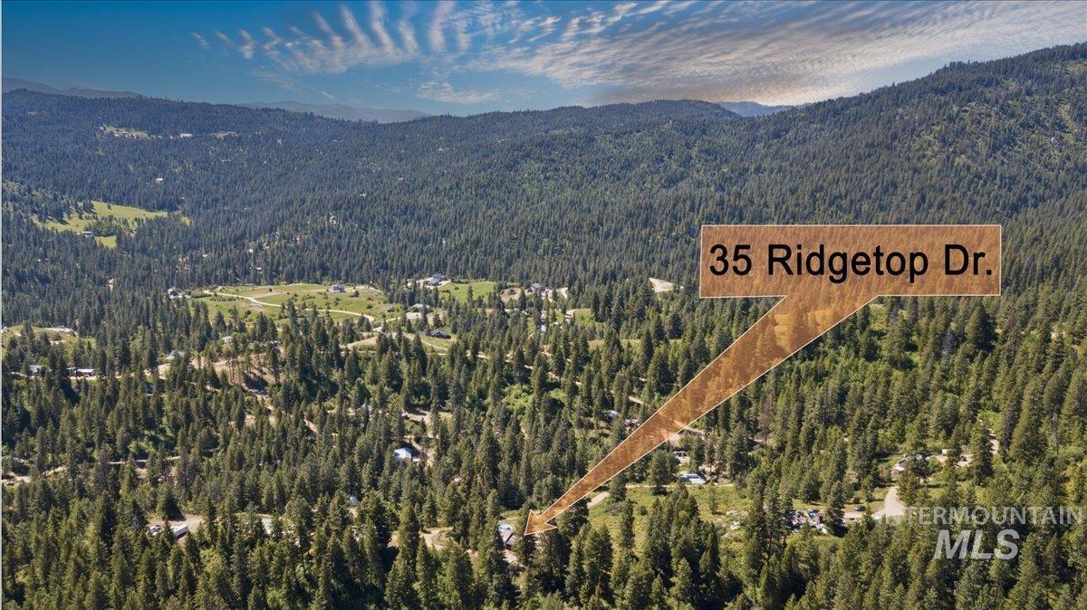 Aerial overview of property's location with a mountain backdrop