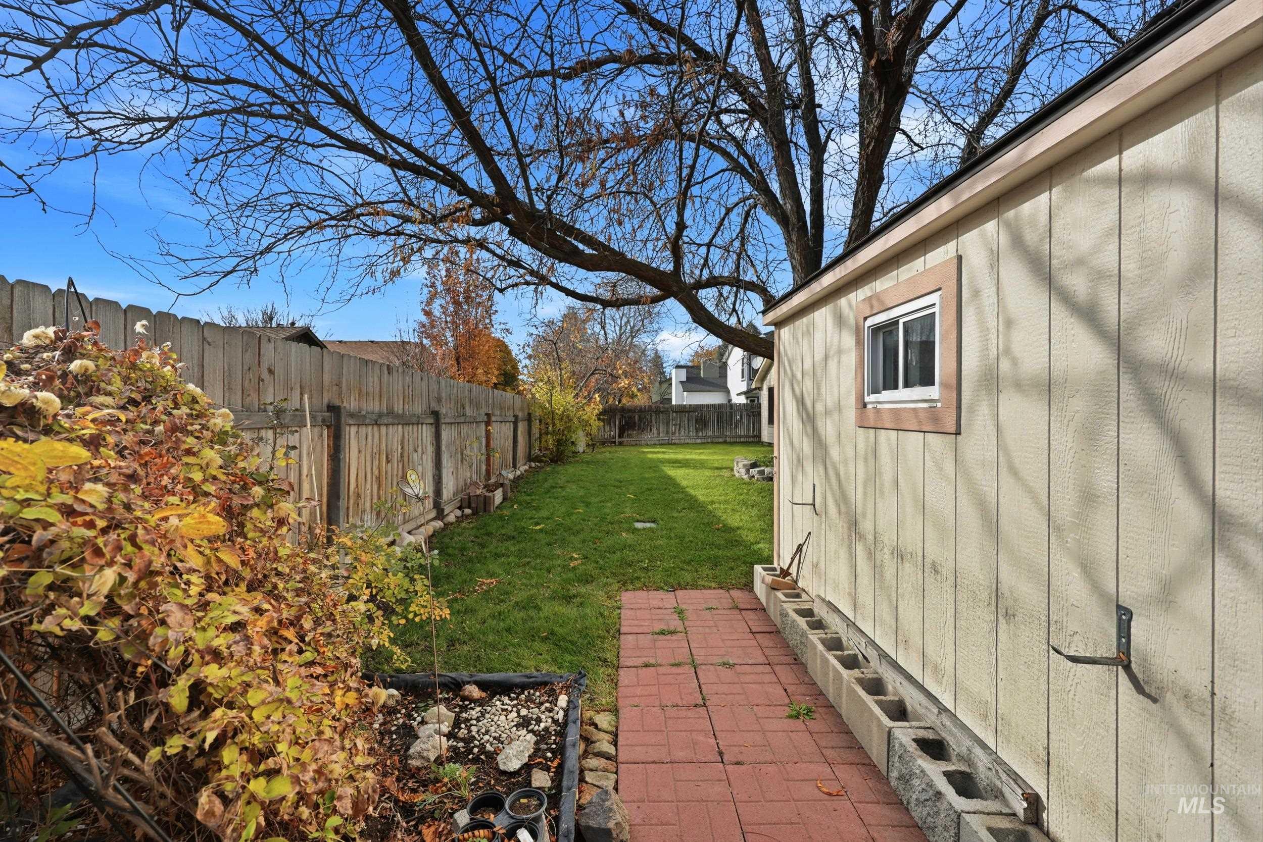 View of fenced backyard