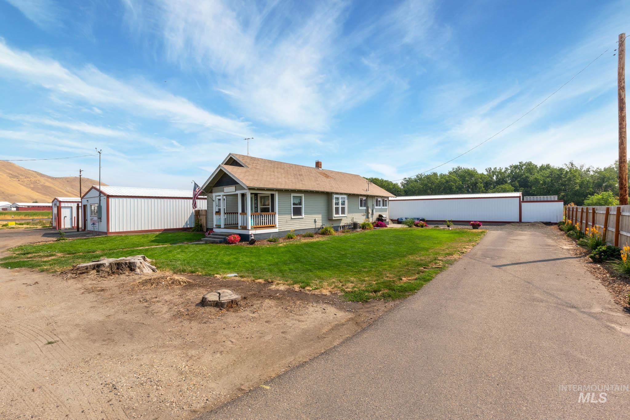 Ranch-style residence with a covered front porch and a paved driveway