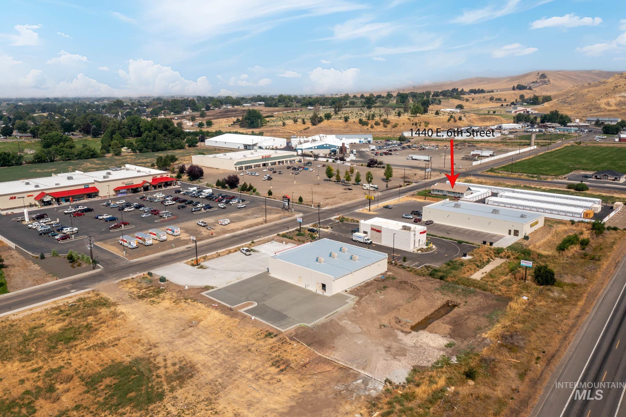 Aerial perspective showcasing an expansive commercial property with multiple buildings