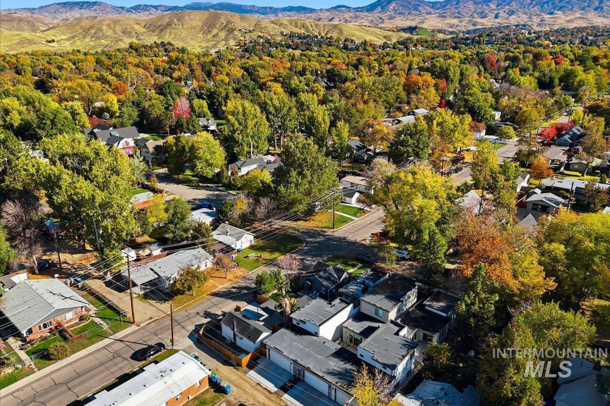 Aerial view of residential area featuring a mountain backdrop