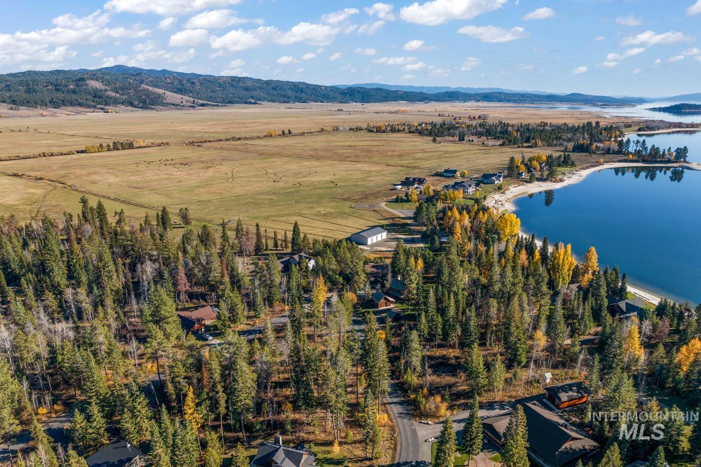 Aerial overview of property's location with a water and mountain view