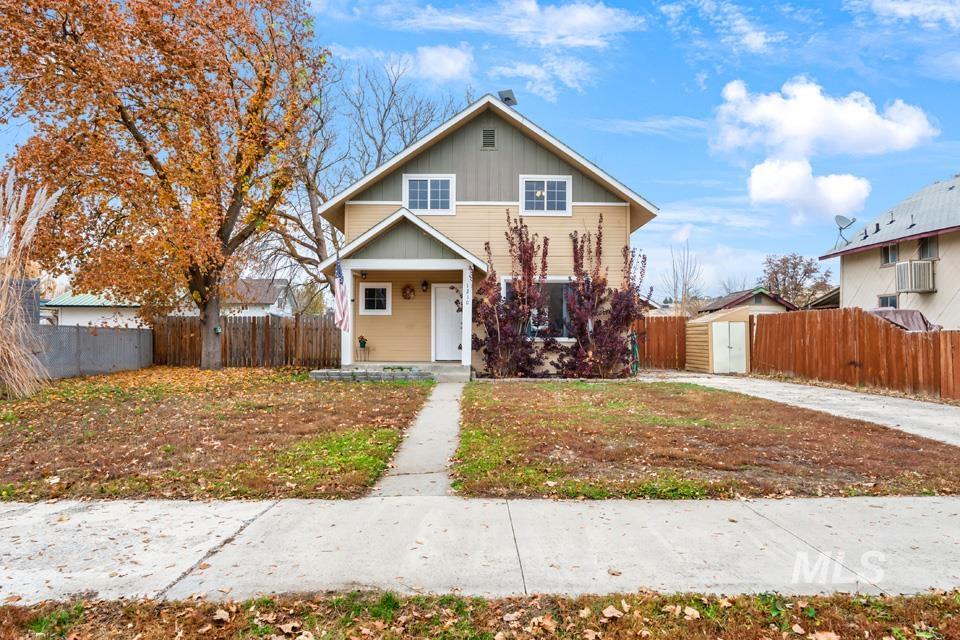 View of front of property featuring covered porch and board and batten siding