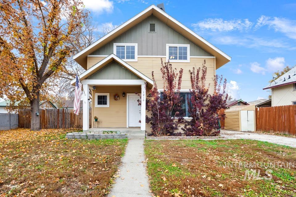 View of front of house featuring board and batten siding and covered porch