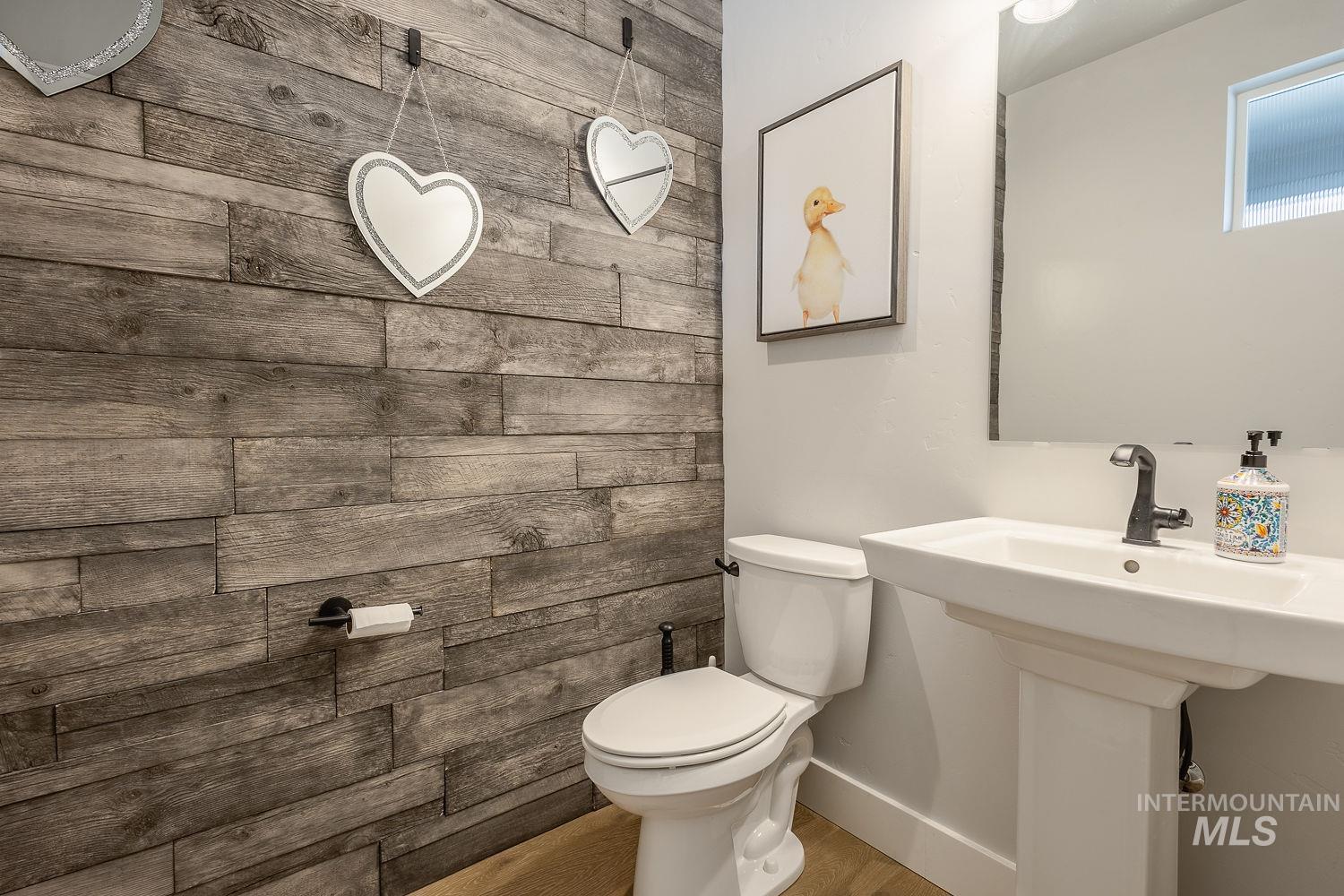 Bathroom with toilet and baseboards
