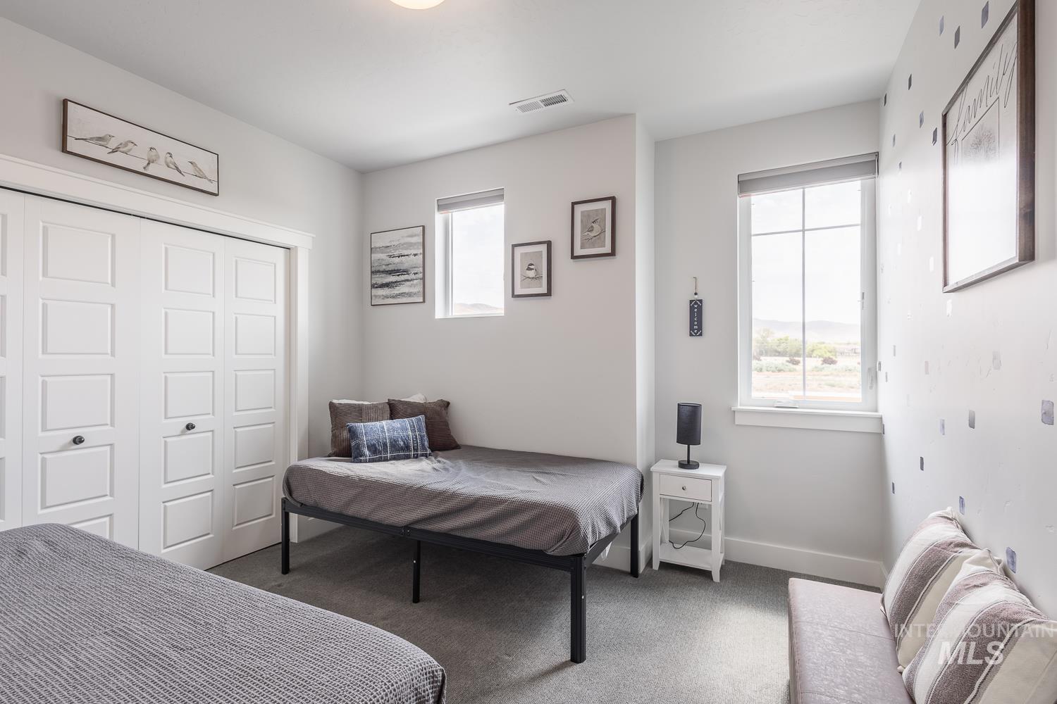 Bedroom featuring carpet flooring and a closet