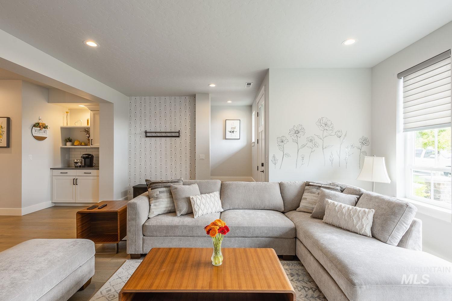 Living room with recessed lighting and wood finished floors